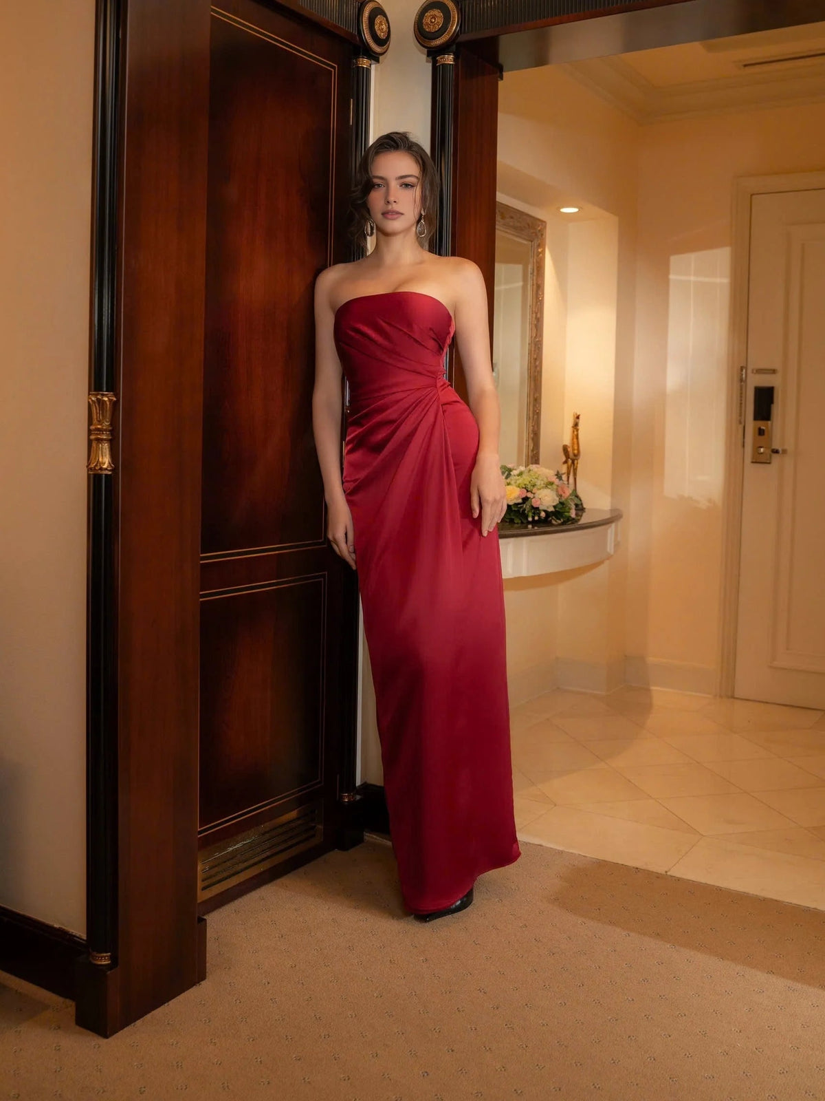 Deep red strapless satin sheath maxi dress with ruched bodice and side drape