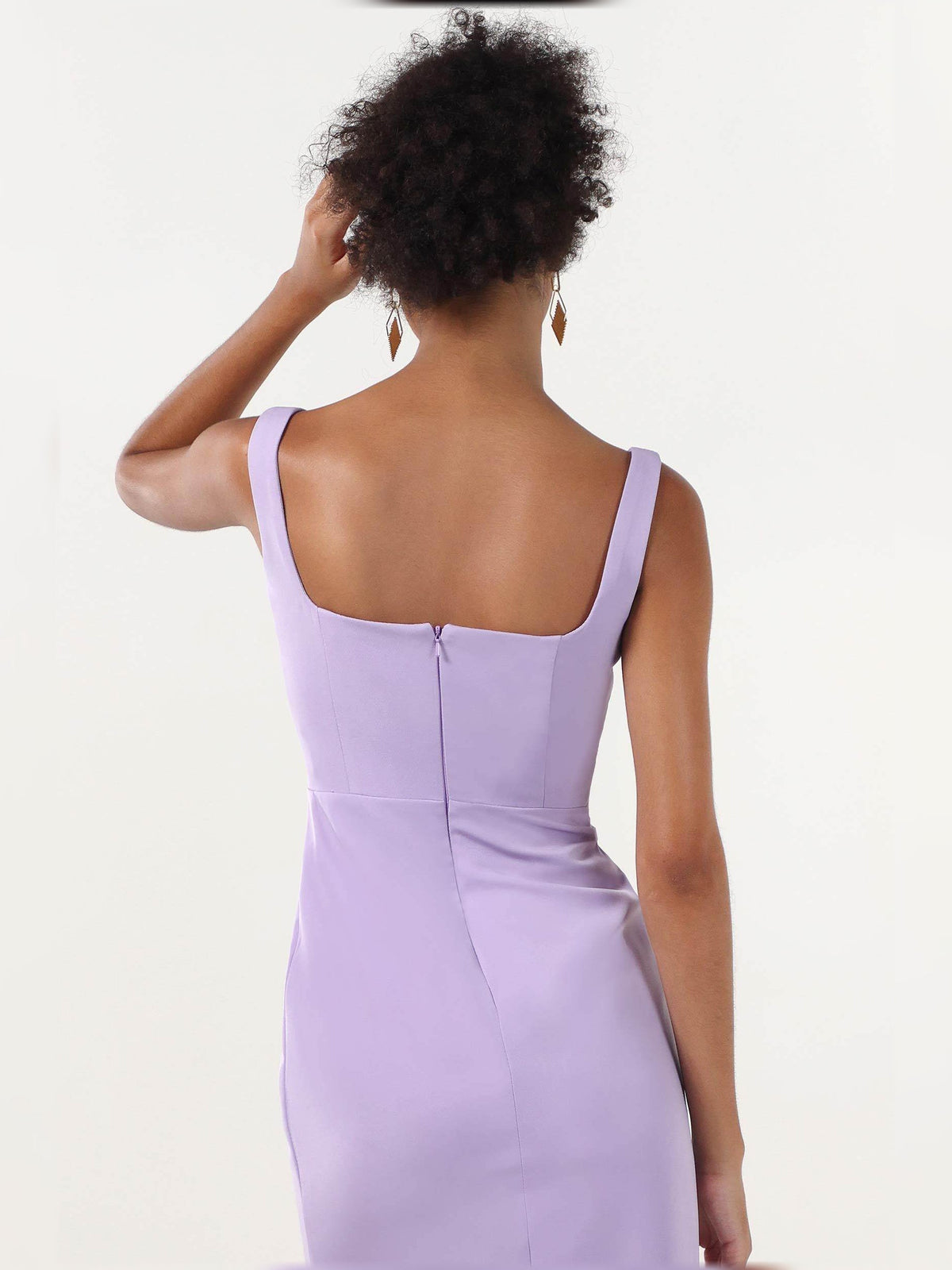 Lilac back view formal dress with thin straps and open slit at the lower hem