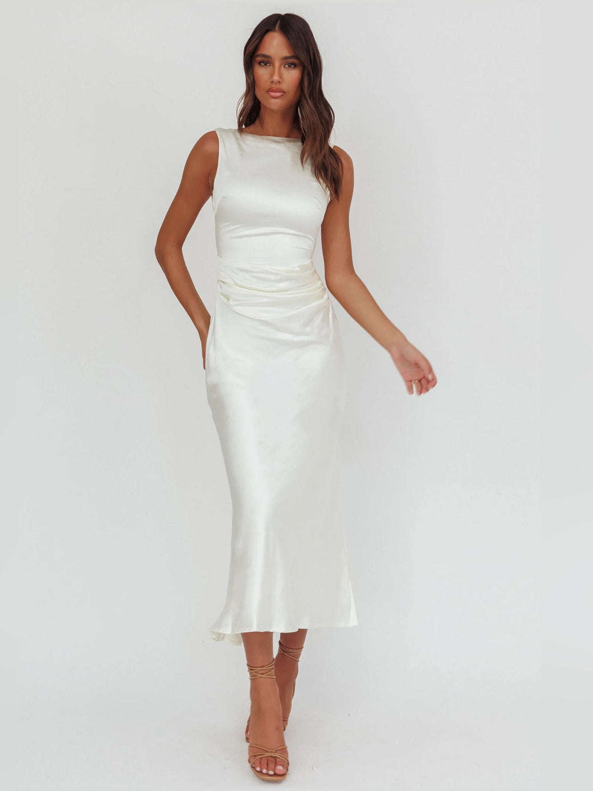 White sleeveless ruched midi formal dress with fitted skirt and draped waist
