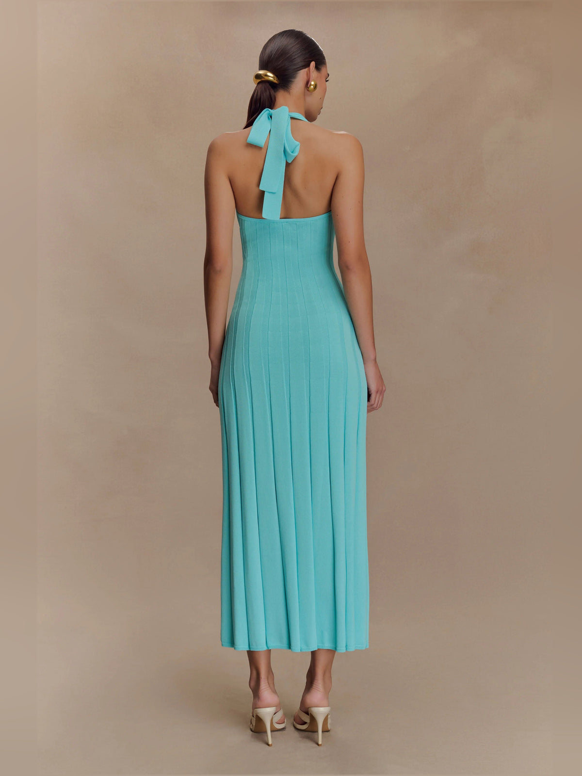 Turquoise halter knit midi dress, open back with tied bow strap detail