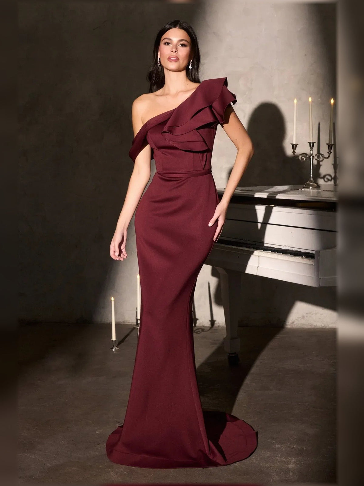 Burgundy one-shoulder ruffle mermaid formal dress, floor-length with layered asymmetric ruffles.