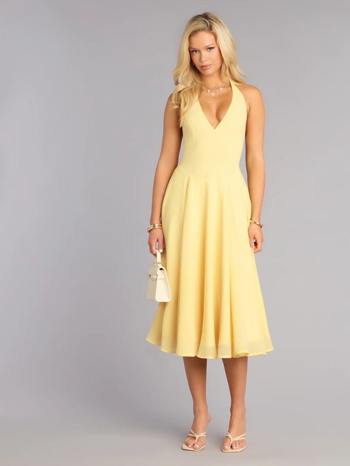 Yellow chiffon midi formal dress with V-neck halter and gathered flared skirt