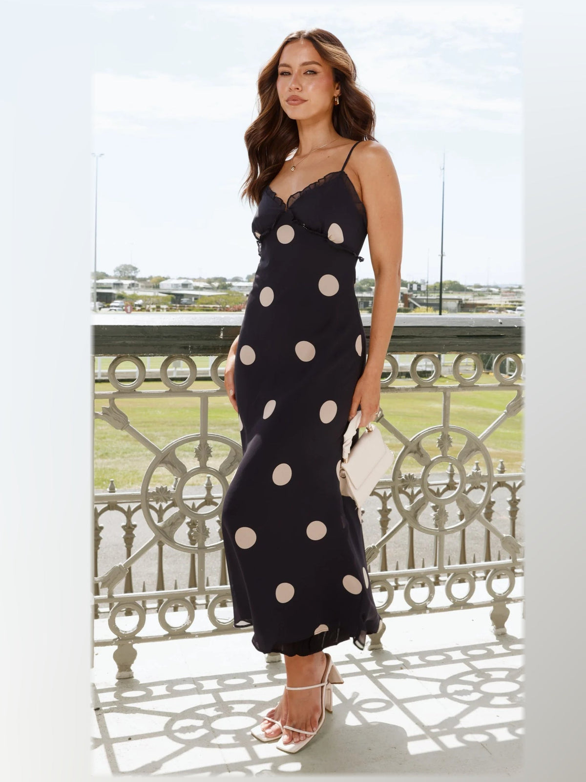 Black maxi formal dress, alternate full-length view showing the hem