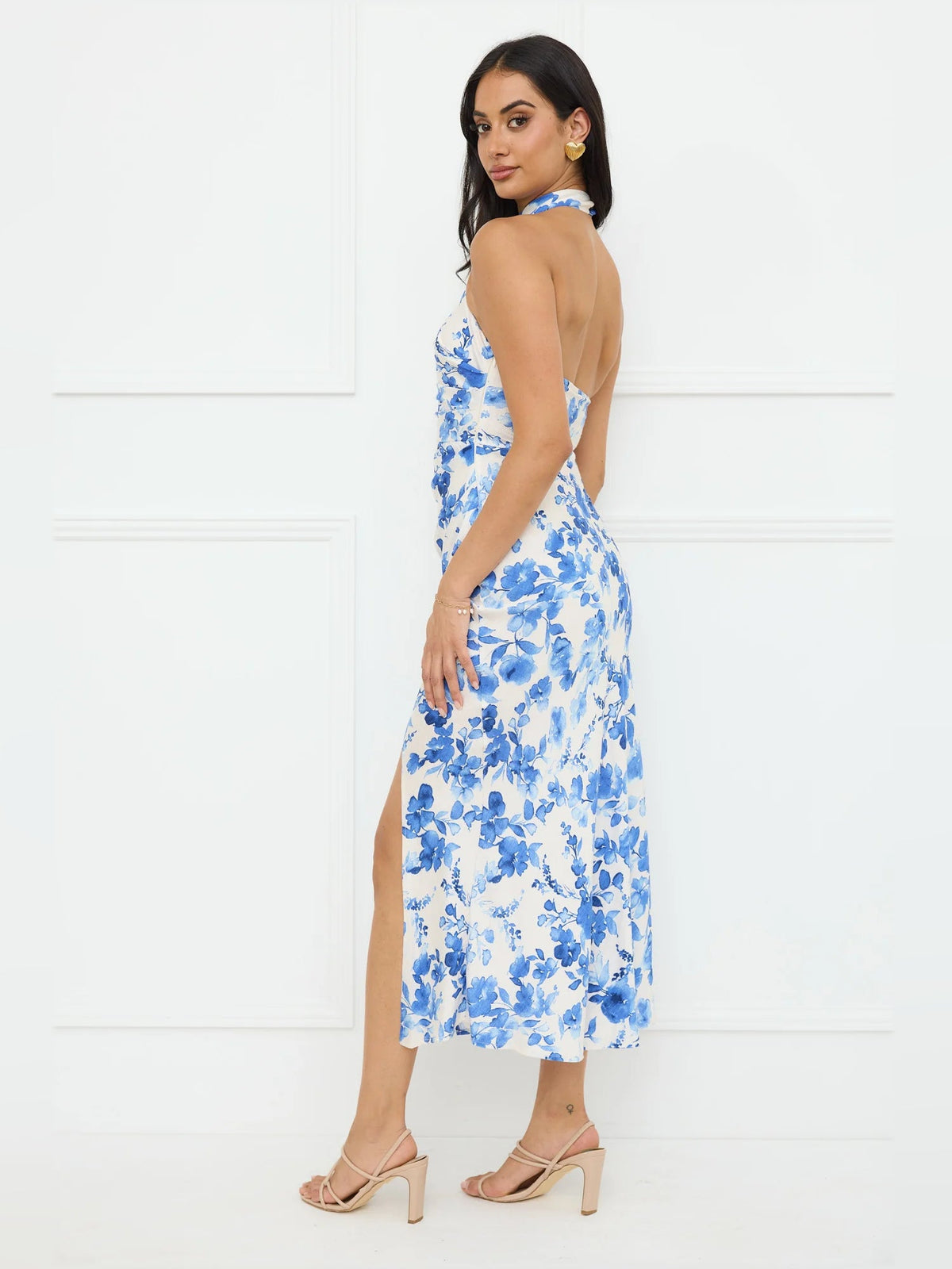 Blue floral halter midi dress from back angle with open halter neckline