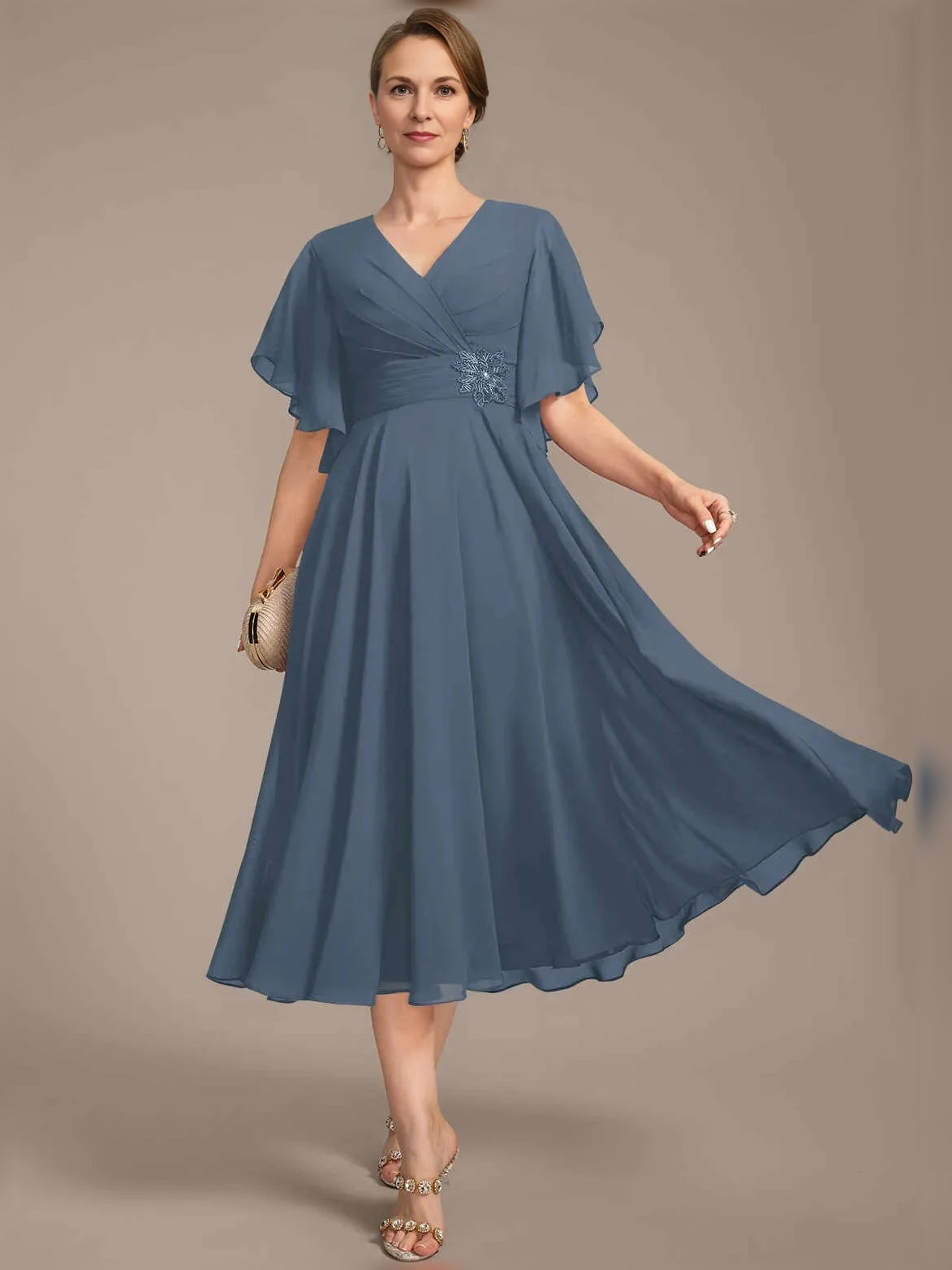 V-neck A-line chiffon dress with draped bodice detail, pleated mid-length skirt, flutter sleeves, blue