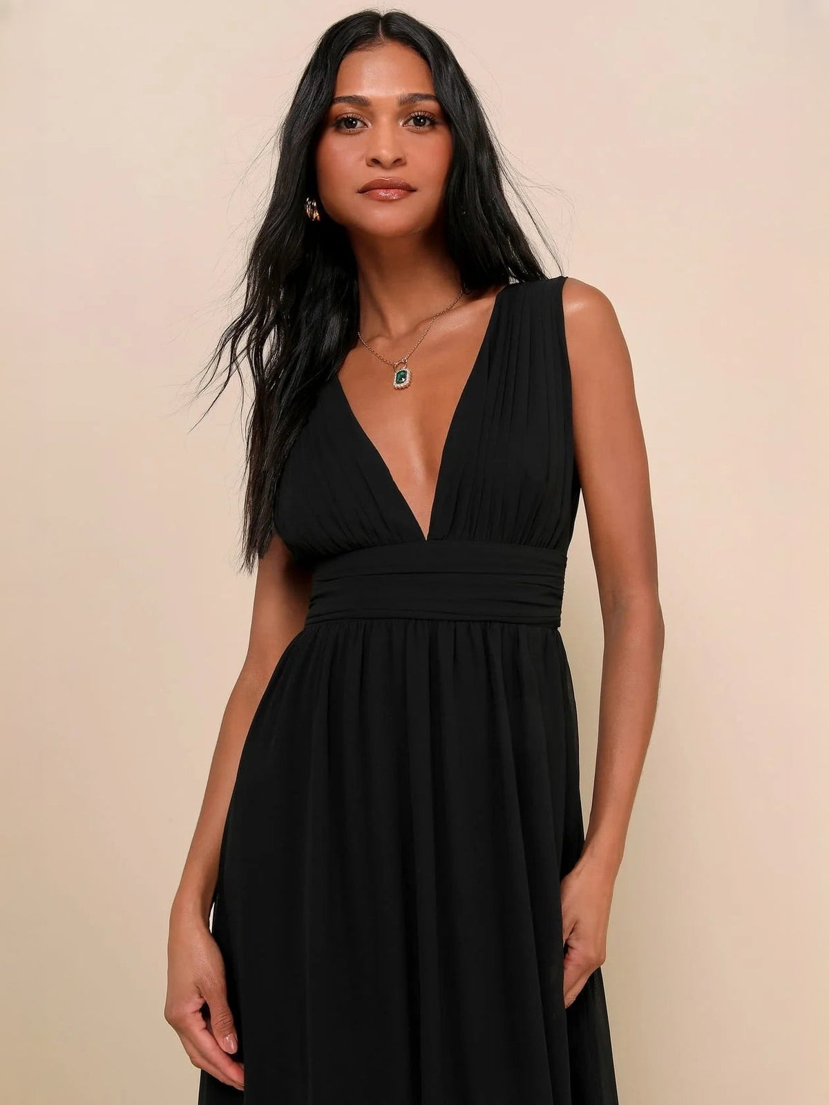 Black sleeveless V-neck A-line maxi dress with ruched waist and side slit