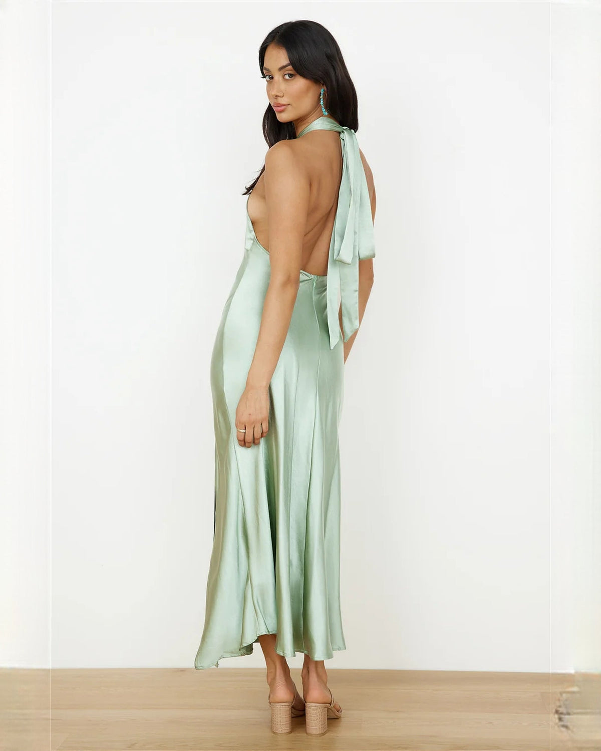 Mint green satin halter maxi dress, back view with long neck tie and flowing skirt