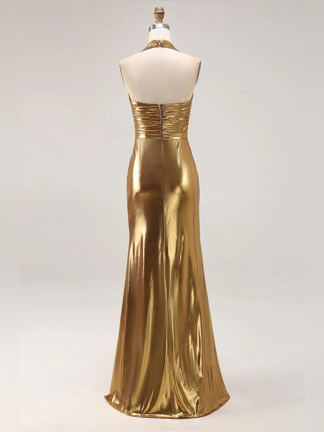 Gold ruched V-neck halter prom dress on mannequin with front slit