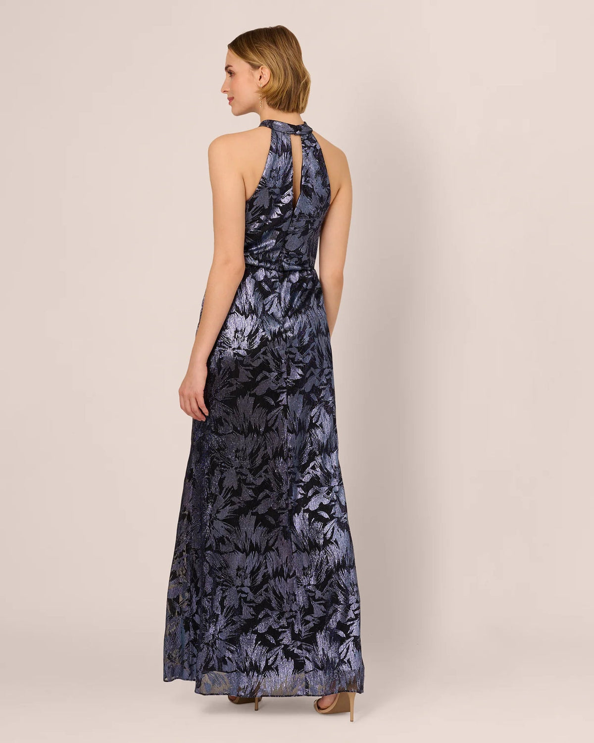 Navy printed maxi dress from back, halter straps and flowing A-line skirt
