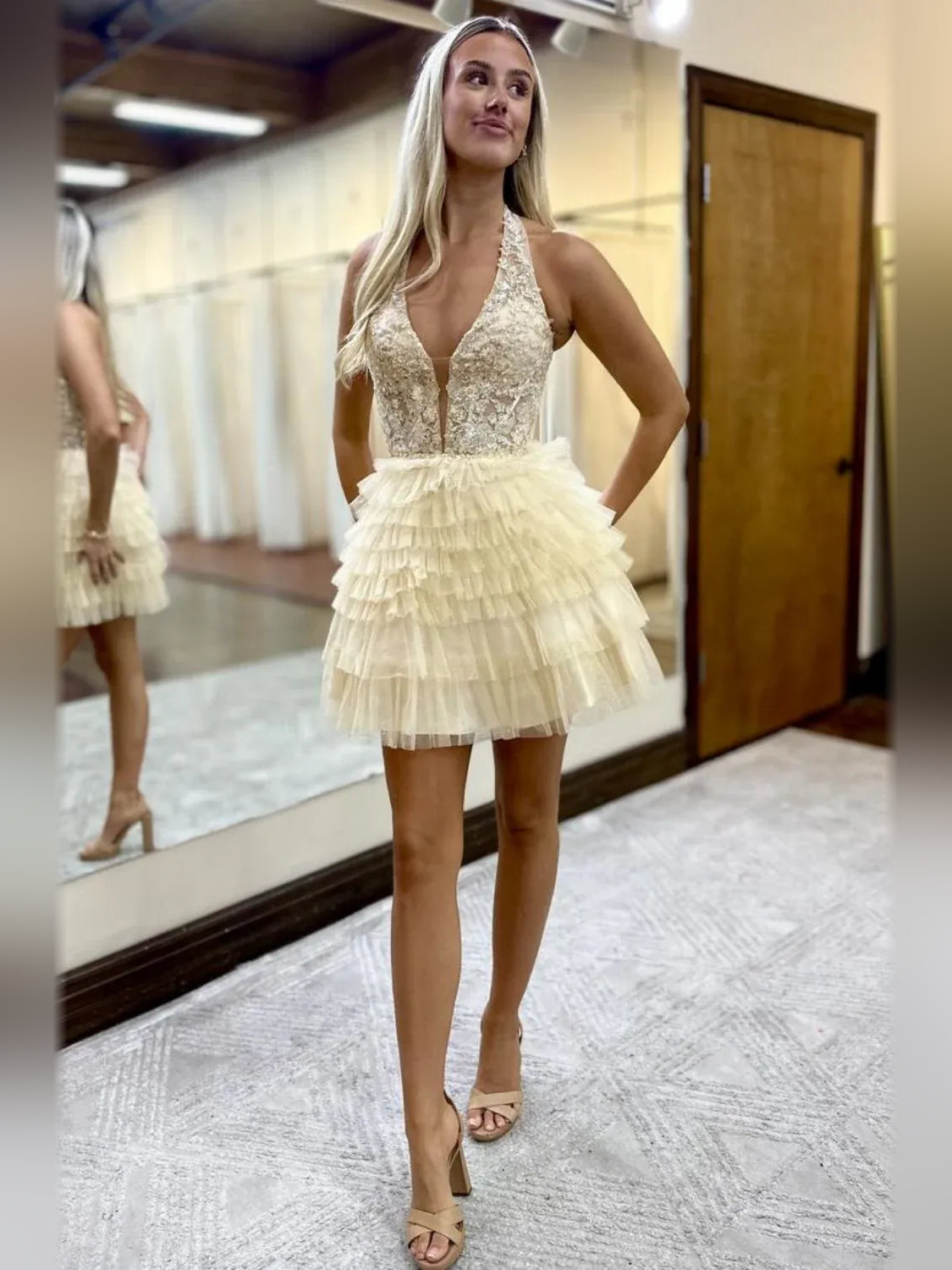 Pale lemon tiered tulle mini dress with deep V-neck bodice and layered ruffle skirt