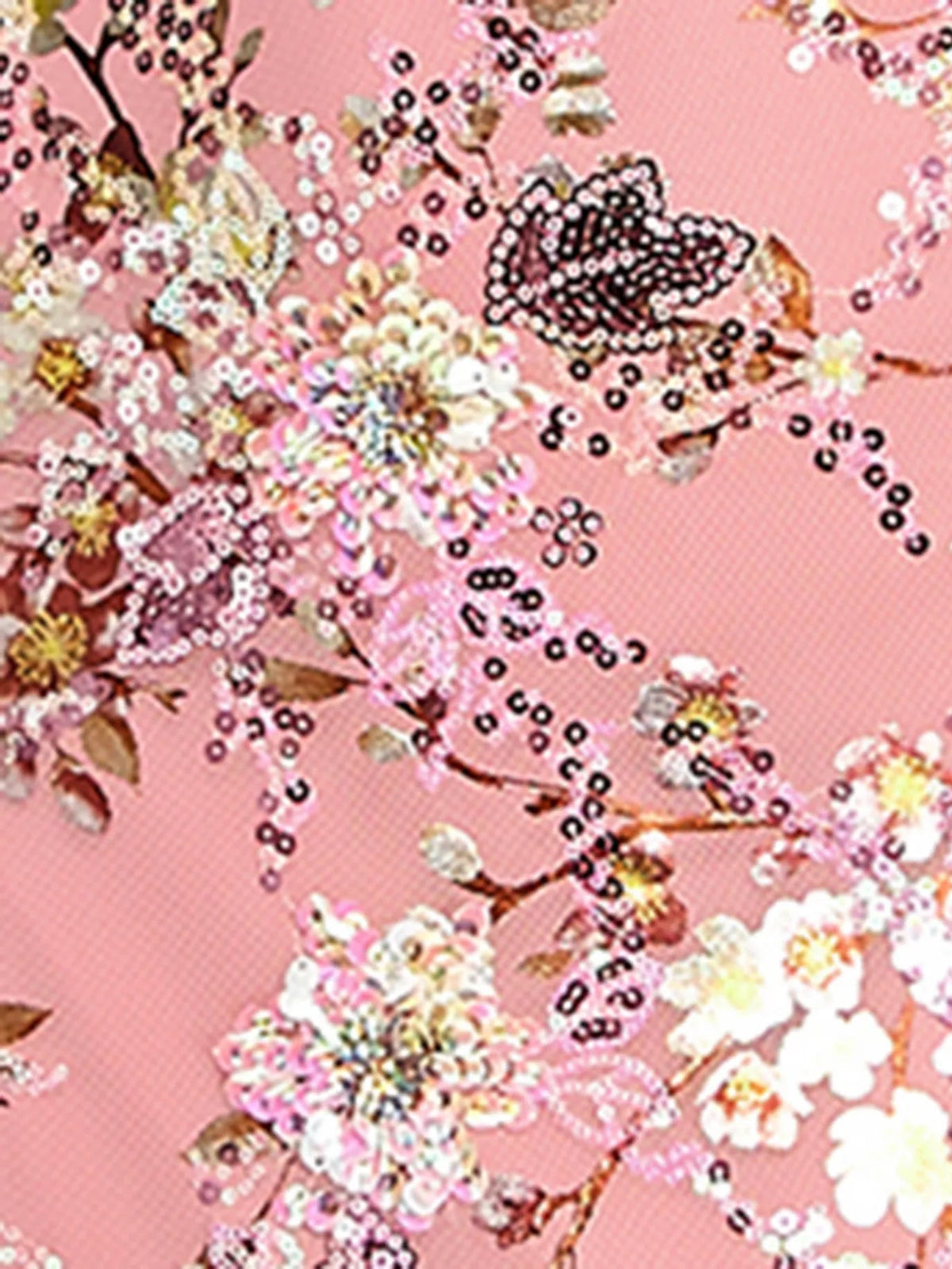 Close-up of pink floral sequin embellishments on mesh fabric