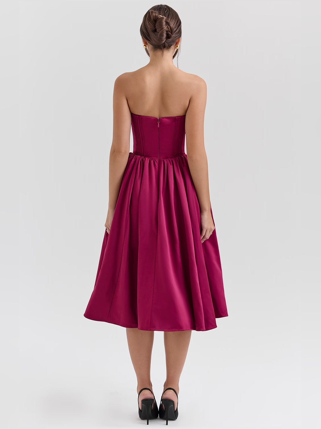 Back view of fuchsia satin tulle midi dress with gathered waist and strapless back