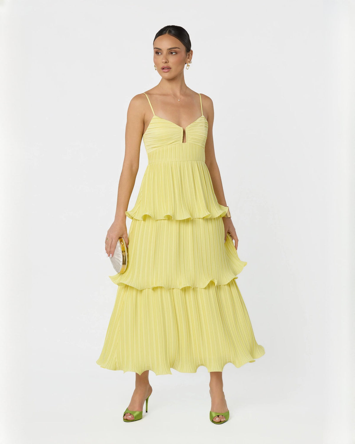 Light yellow sleeveless tiered maxi dress with V-neck and layered ruffle hem