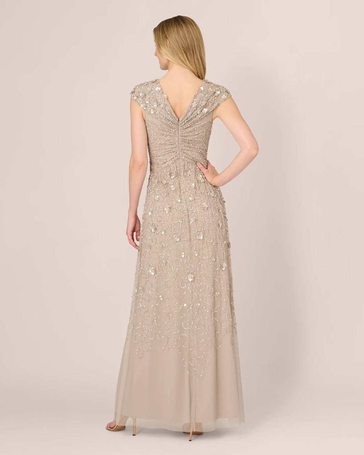 Silver cap-sleeve maxi dress with open-back look and draped V-back sequin embellishment