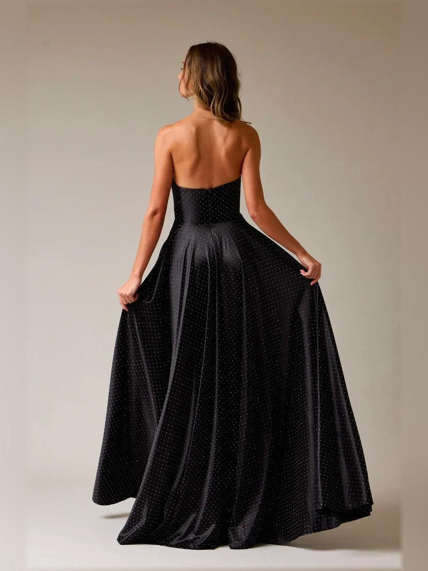Black strapless A-line satin floor-length formal dress, open back view