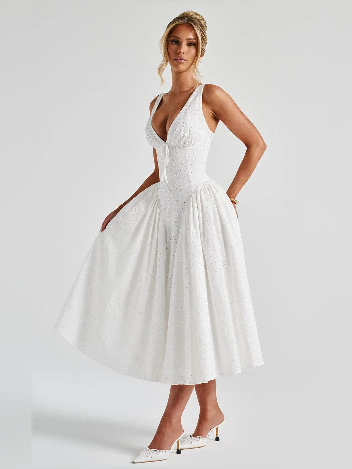 Ivory midi formal dress with V-neckline, fitted bodice, and flared gathered skirt