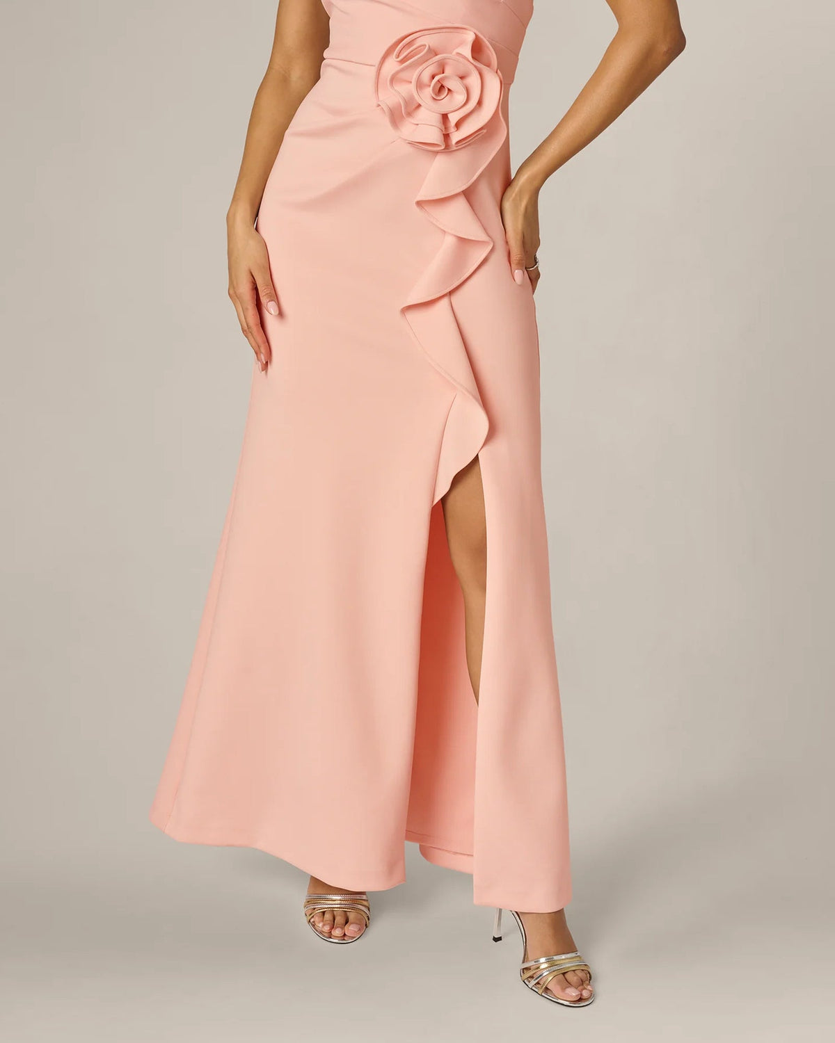 Pink maxi dress with front slit and layered ruffle rosette applique