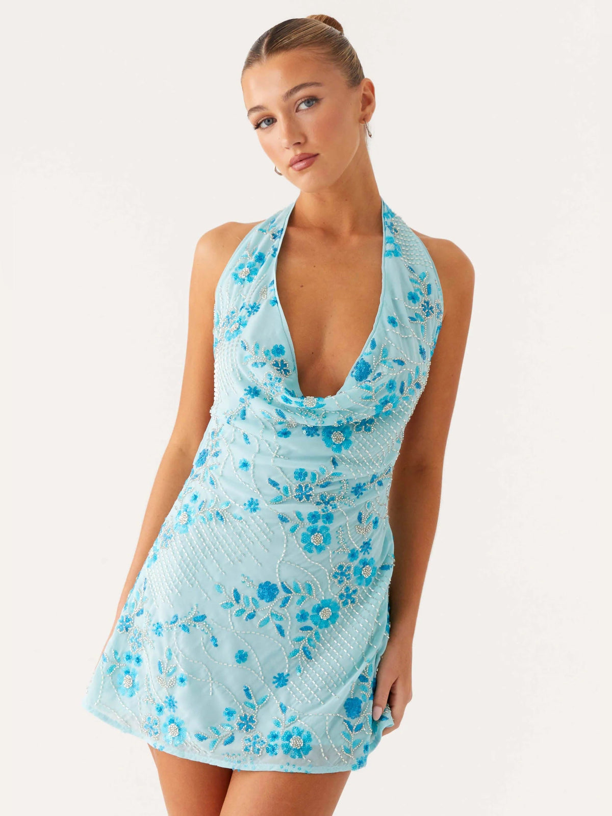 Blue beaded mini homecoming dress close front, halter neck and floral beaded pattern