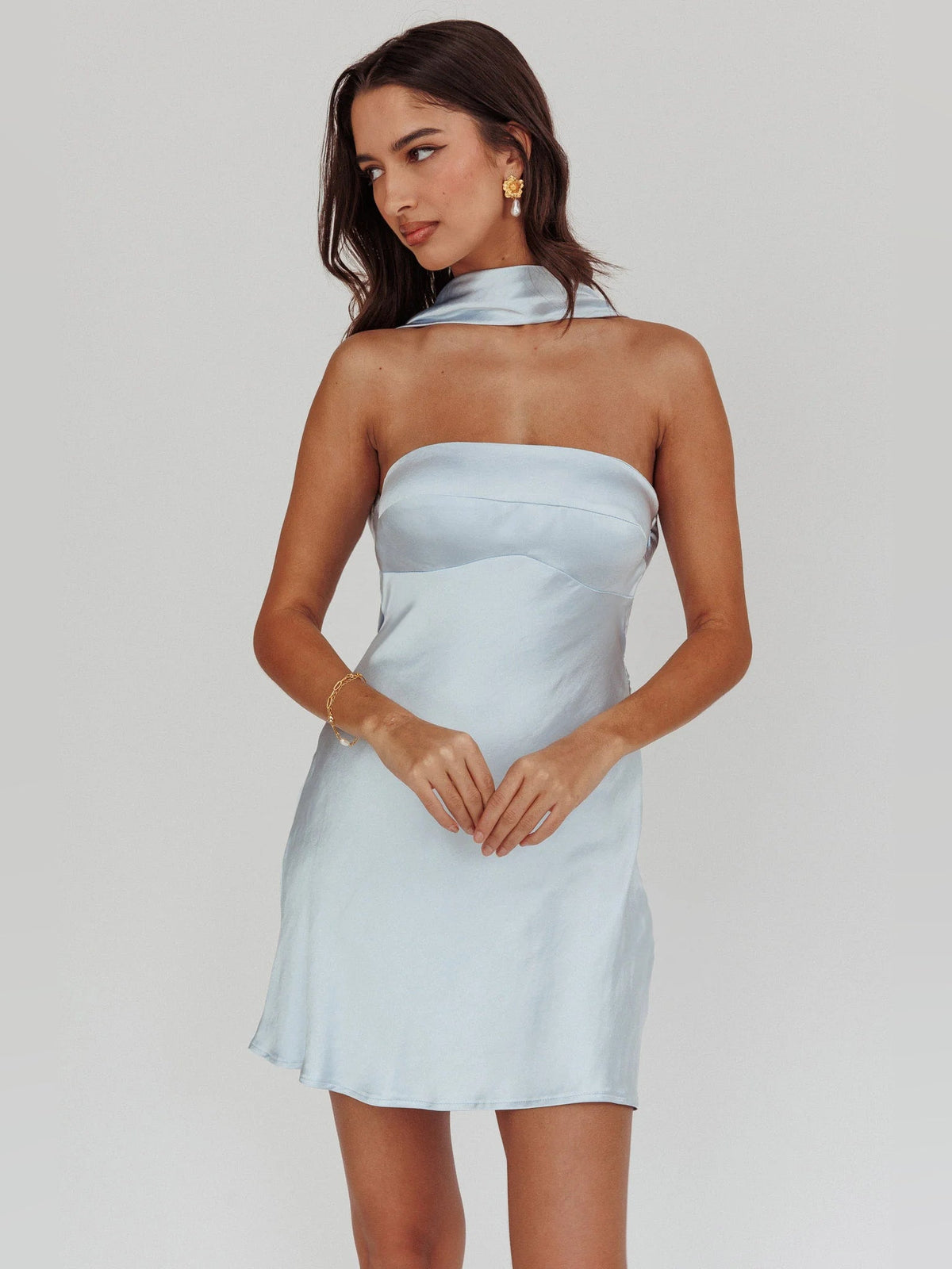 Light blue halter-neck mini dress with choker-style neckline and fitted gathered bodice