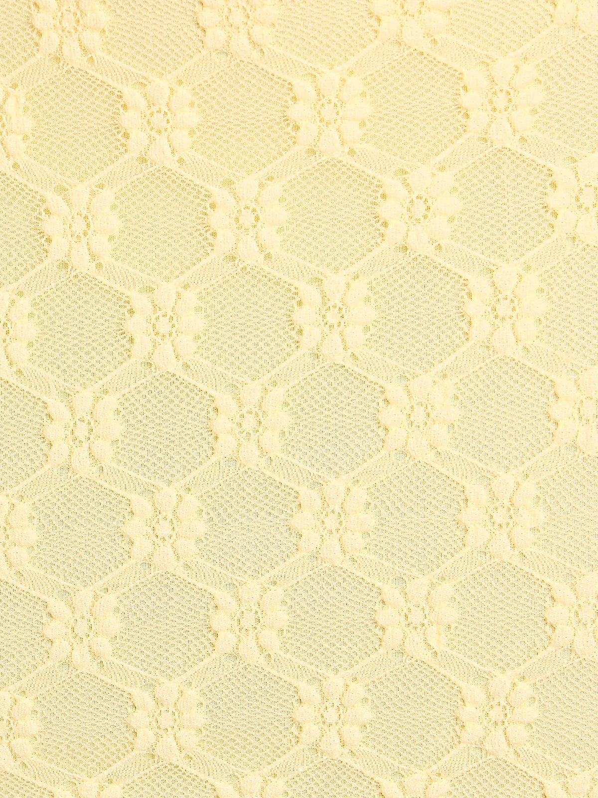 Close-up of yellow textured lace-like fabric with ruched pattern