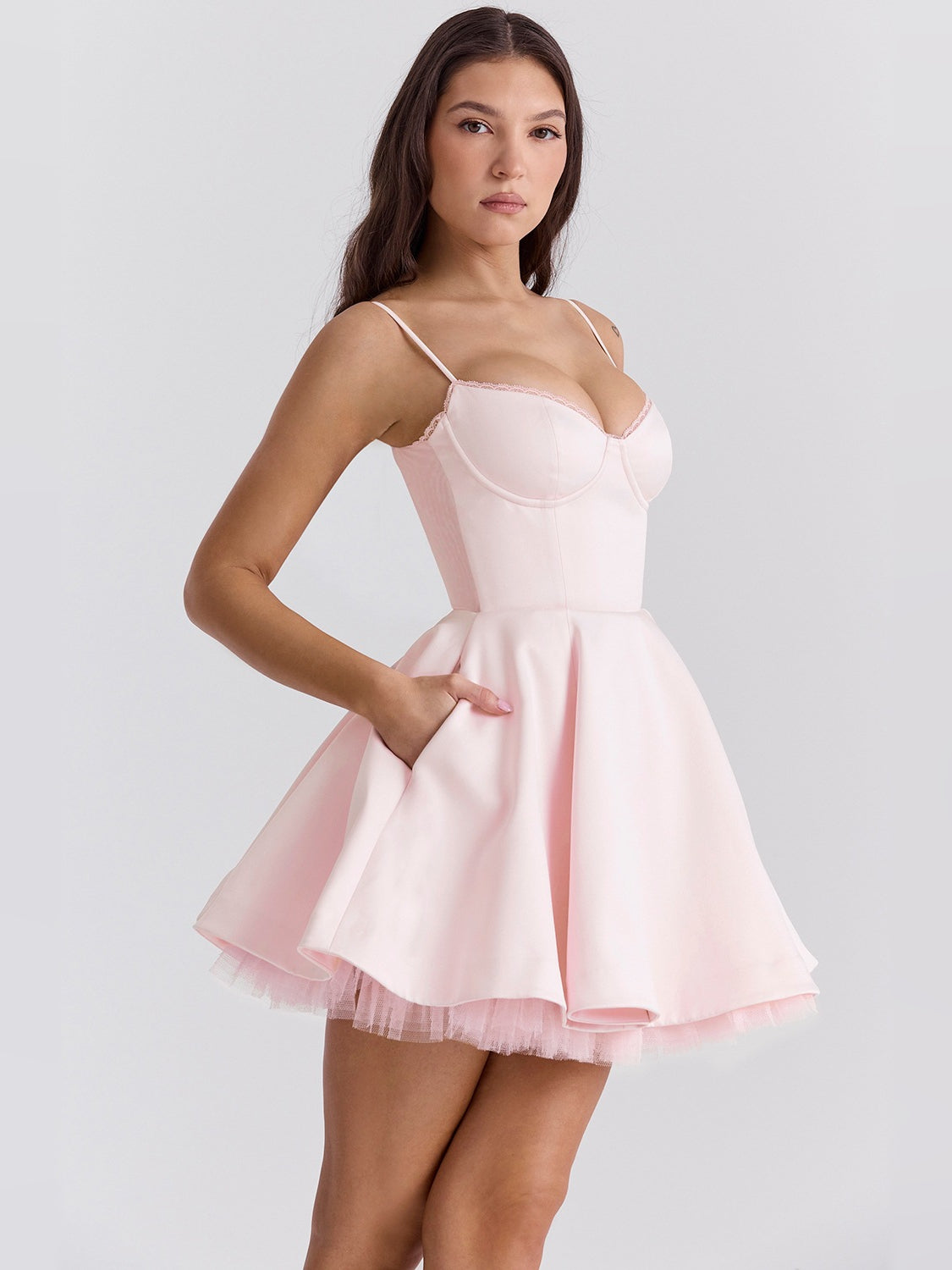 Pink mini dress with spaghetti straps and sweetheart corset bodice, flared tulle skirt