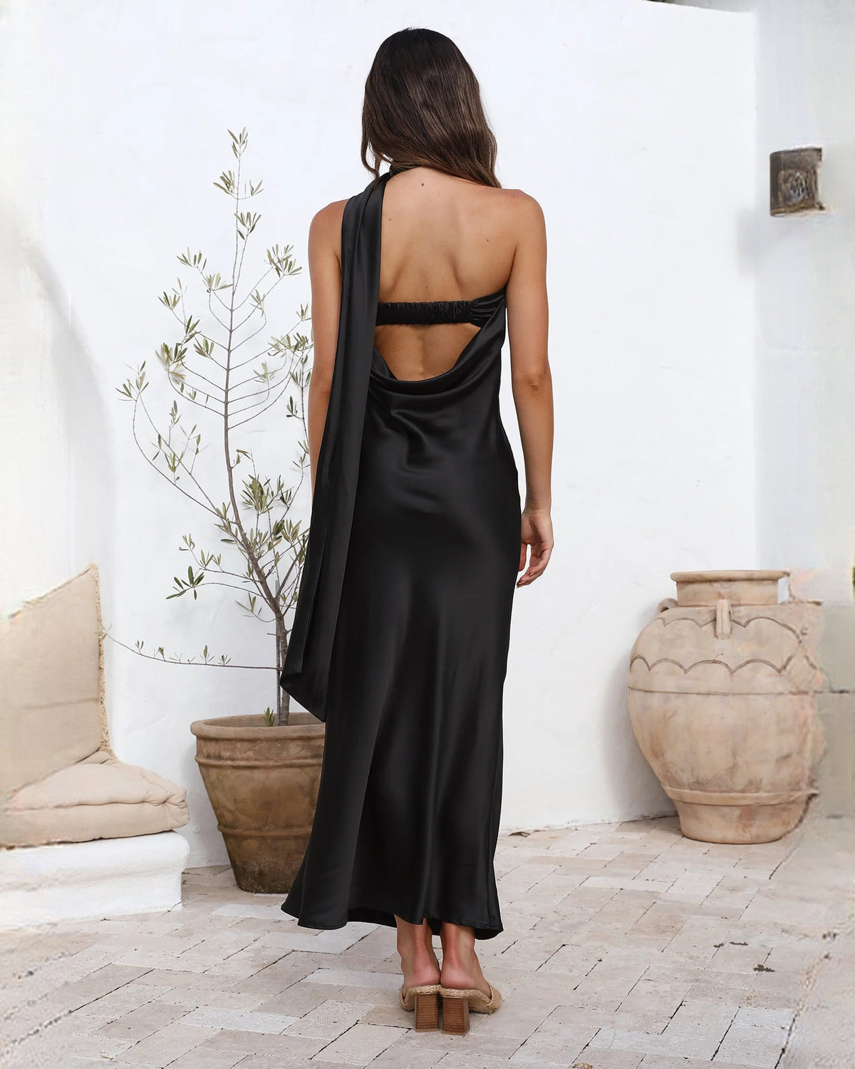 Satin A-line maxi bridesmaid dress, black open-back design with low circular cutout