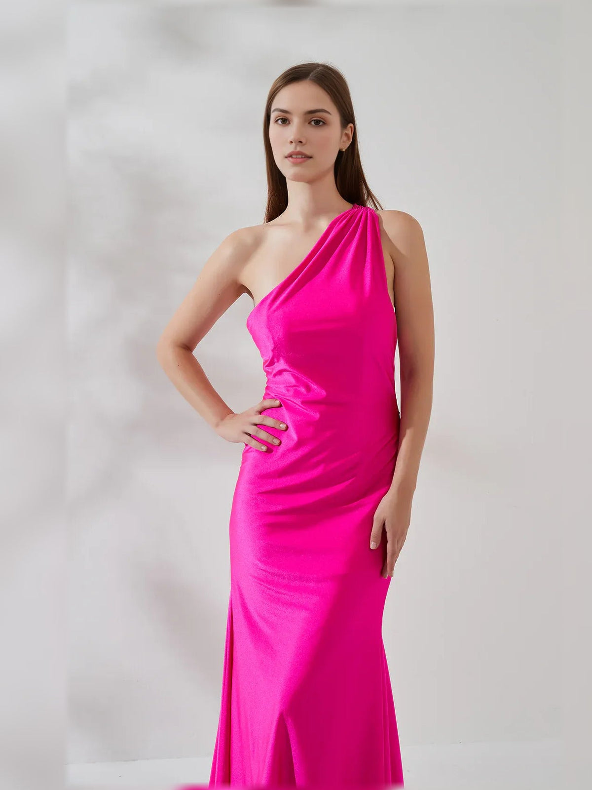 Hot pink one-shoulder mermaid gown with asymmetrical neckline and smooth fitted skirt