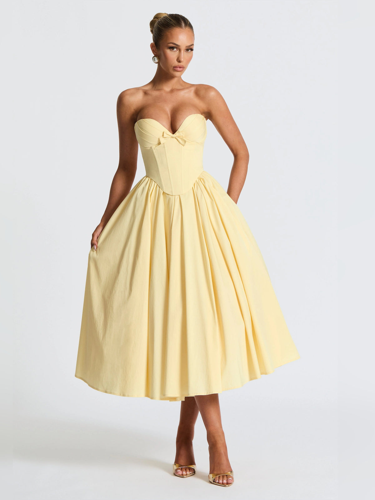 Lemon yellow strapless sweetheart midi formal dress with corset seams and bow-front waist