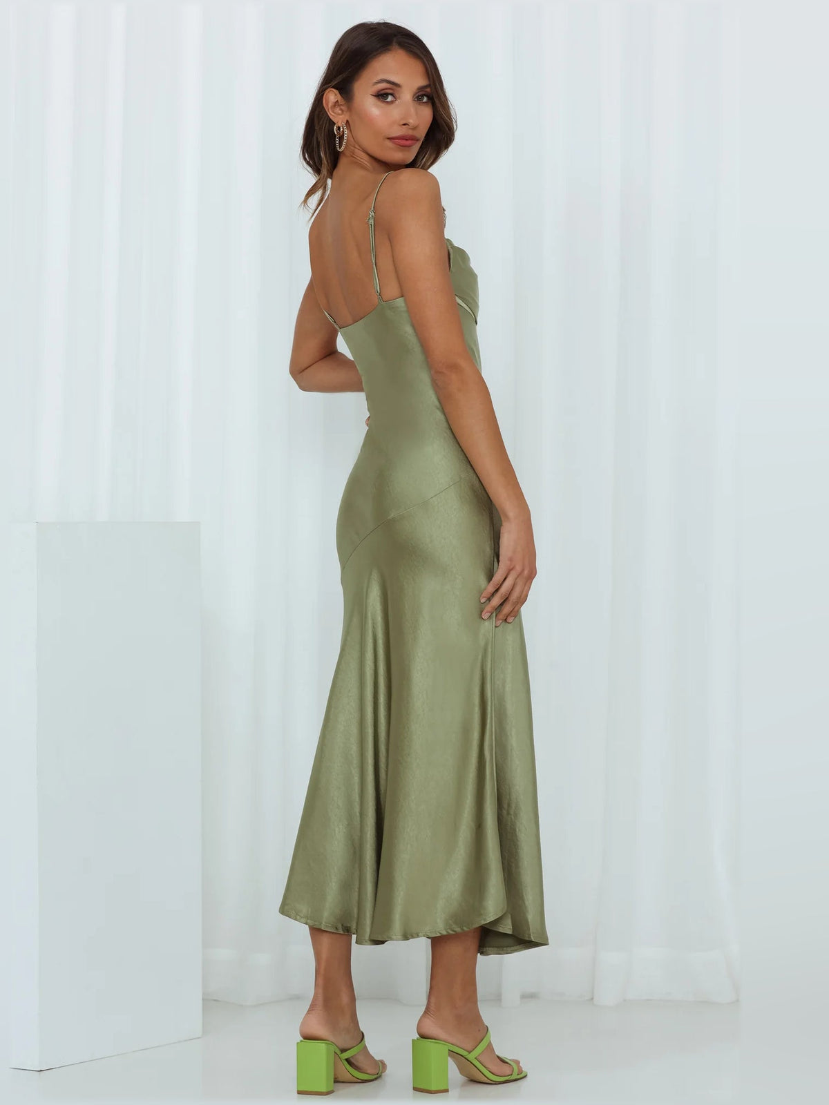 Olive satin midi dress with spaghetti straps and flowing skirt