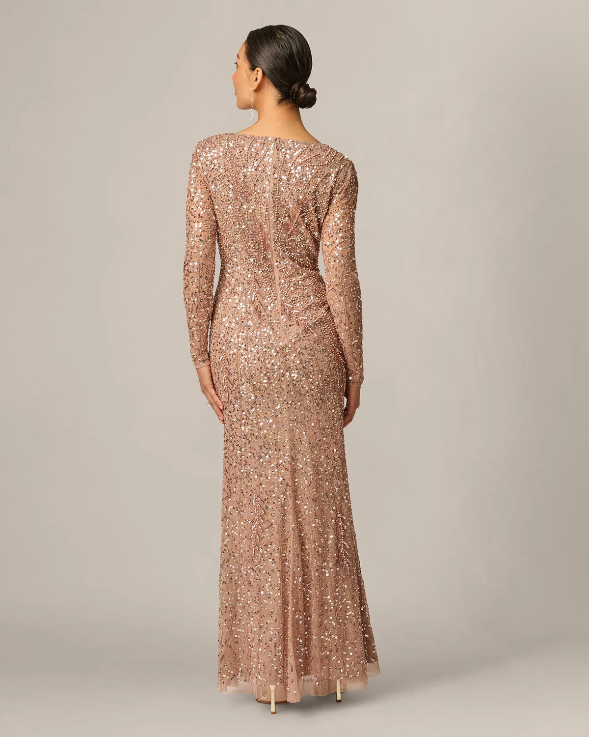 Rose gold sequin long-sleeve maxi dress, back view with full-length skirt