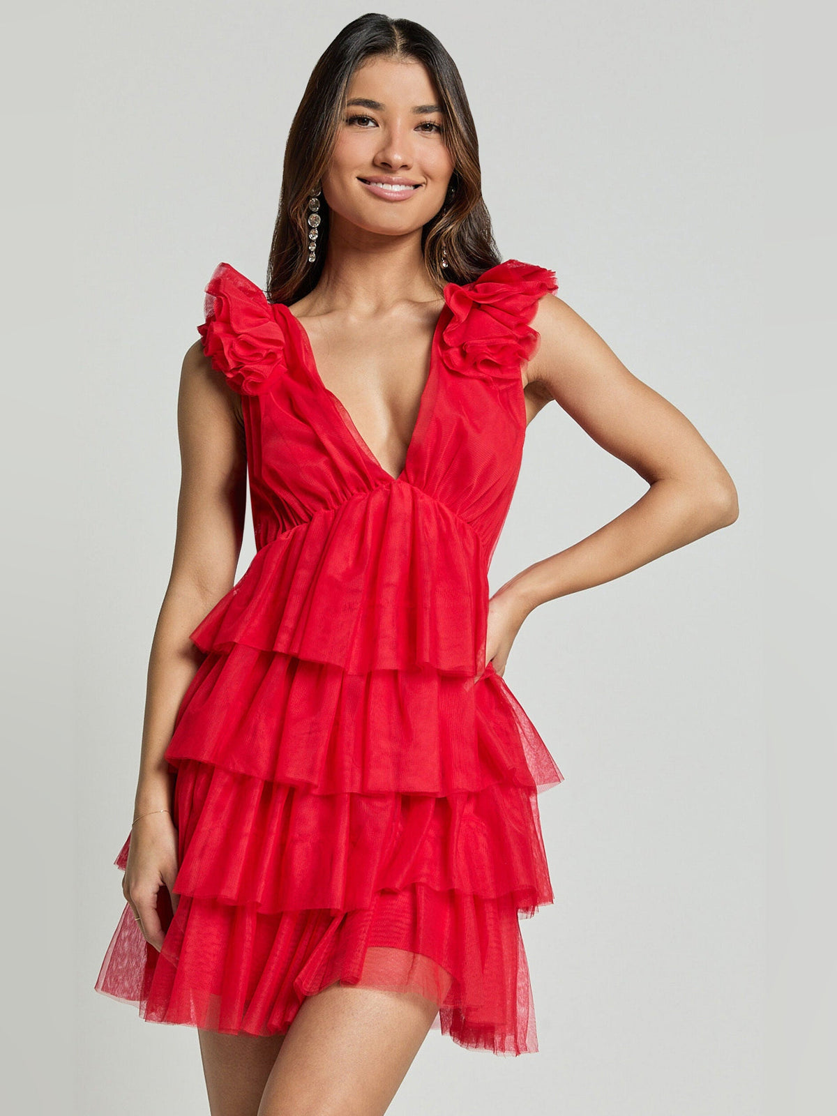 Red V-neck tiered tulle mini dress with oversized ruffle shoulder details and layered skirt