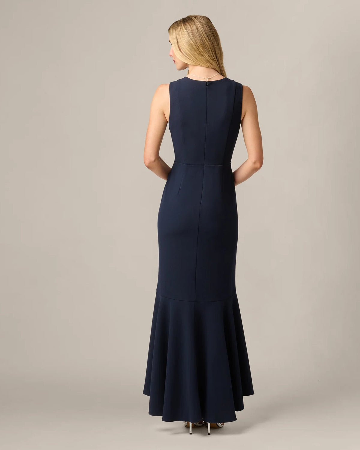 Midnight blue sleeveless mermaid maxi dress, back view with draped ruffle detail