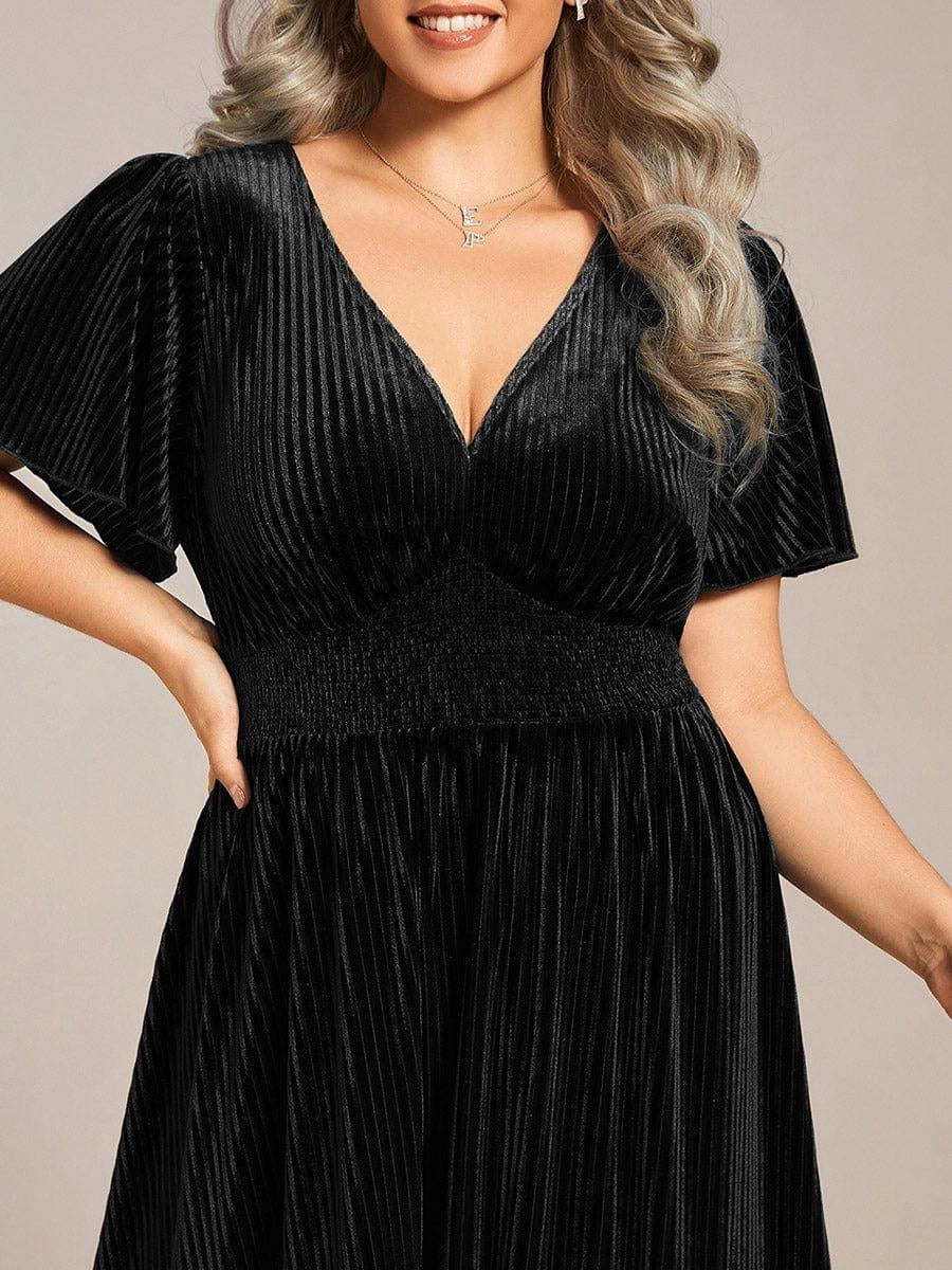 Black velvet A-line midi dress with V-neck and flutter sleeves