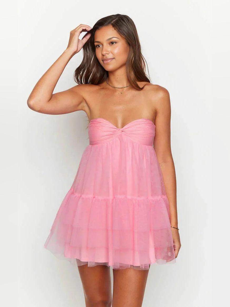 Hot pink strapless sweetheart mini tulle dress with bow detail and tiered ruffles