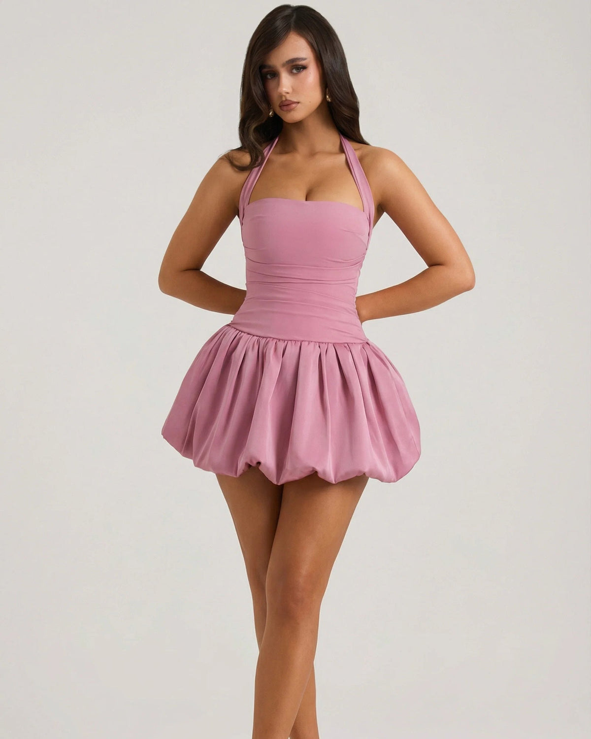 Mauve halter mini dress with corset bodice, ruched seams, and pleated skirt