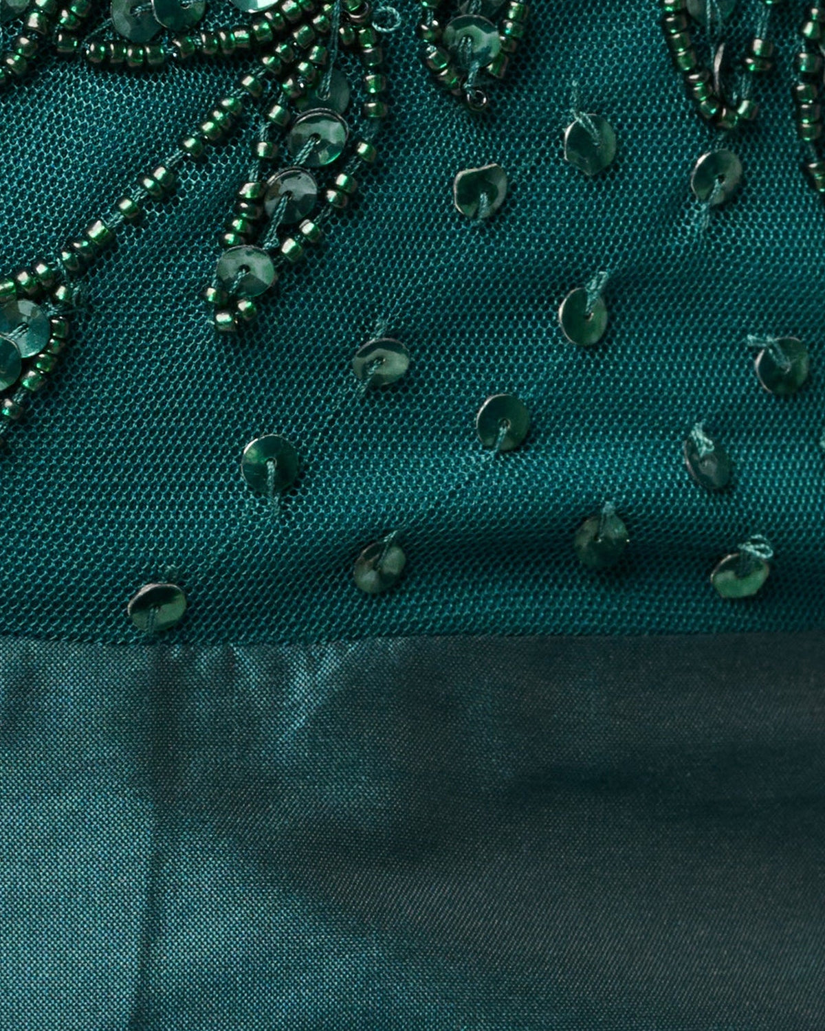 Teal green beaded mesh fabric with textured bead drops