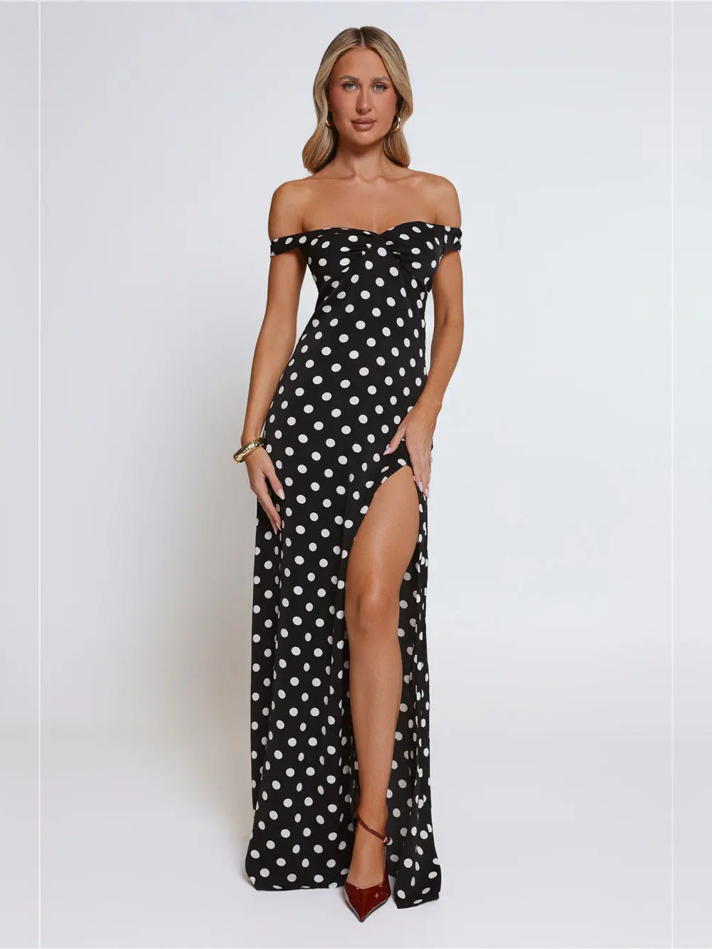 Black a-line maxi formal dress with skirt slit, alternate view showing the hem