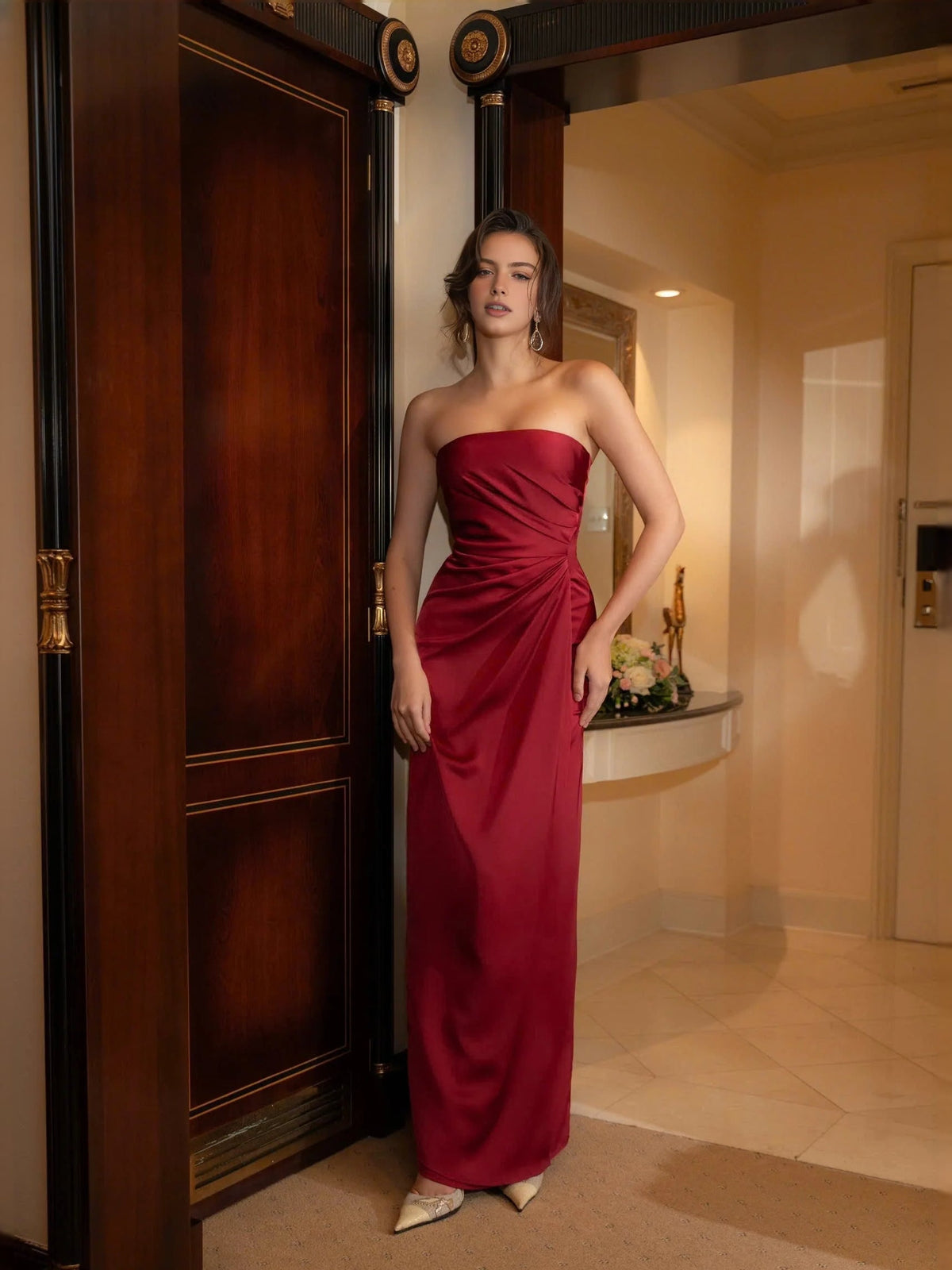Deep red strapless satin sheath maxi dress with gathered ruche detail on bodice