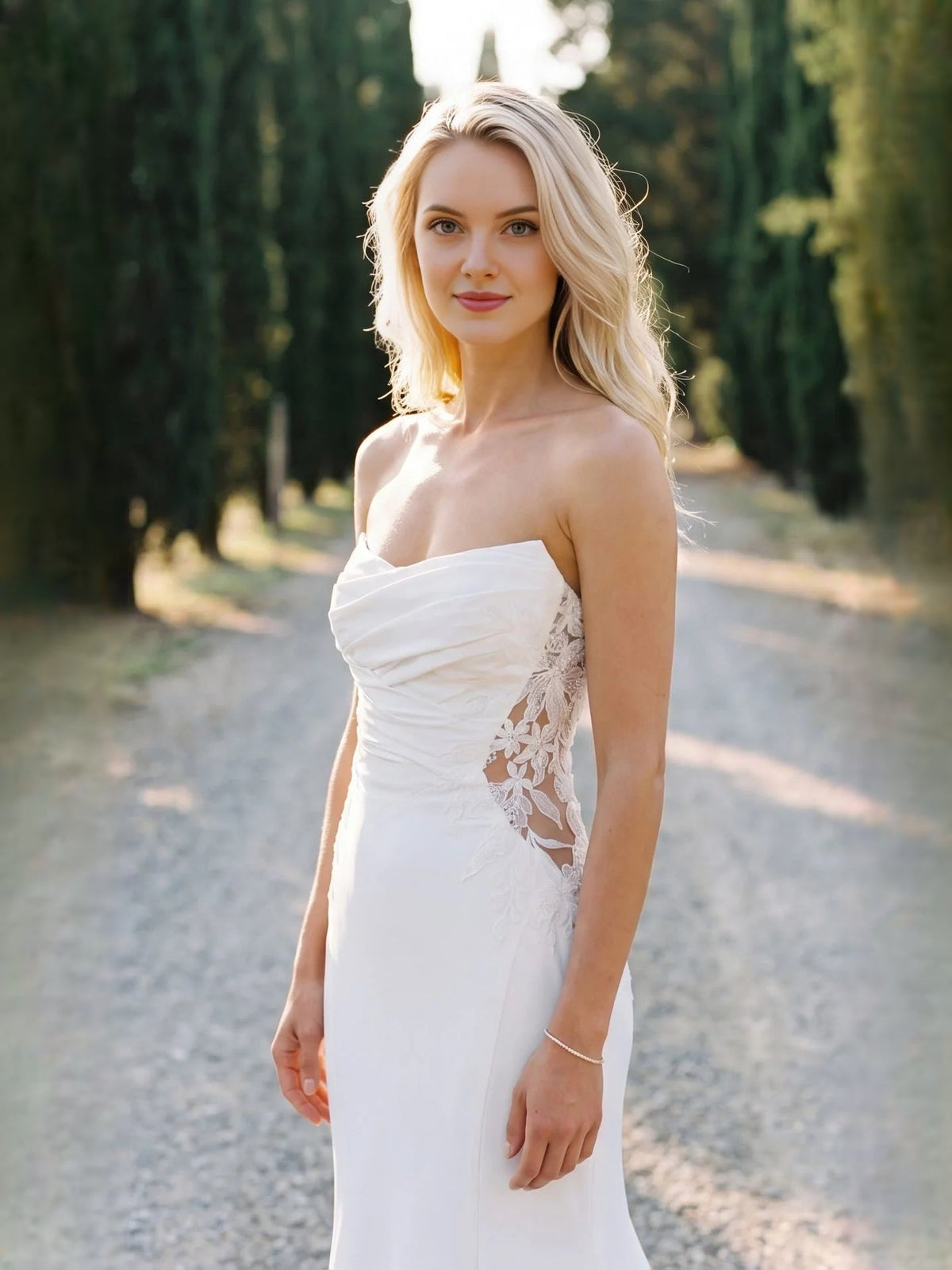 Ivory strapless ruched corset mermaid wedding dress with floral lace side panels