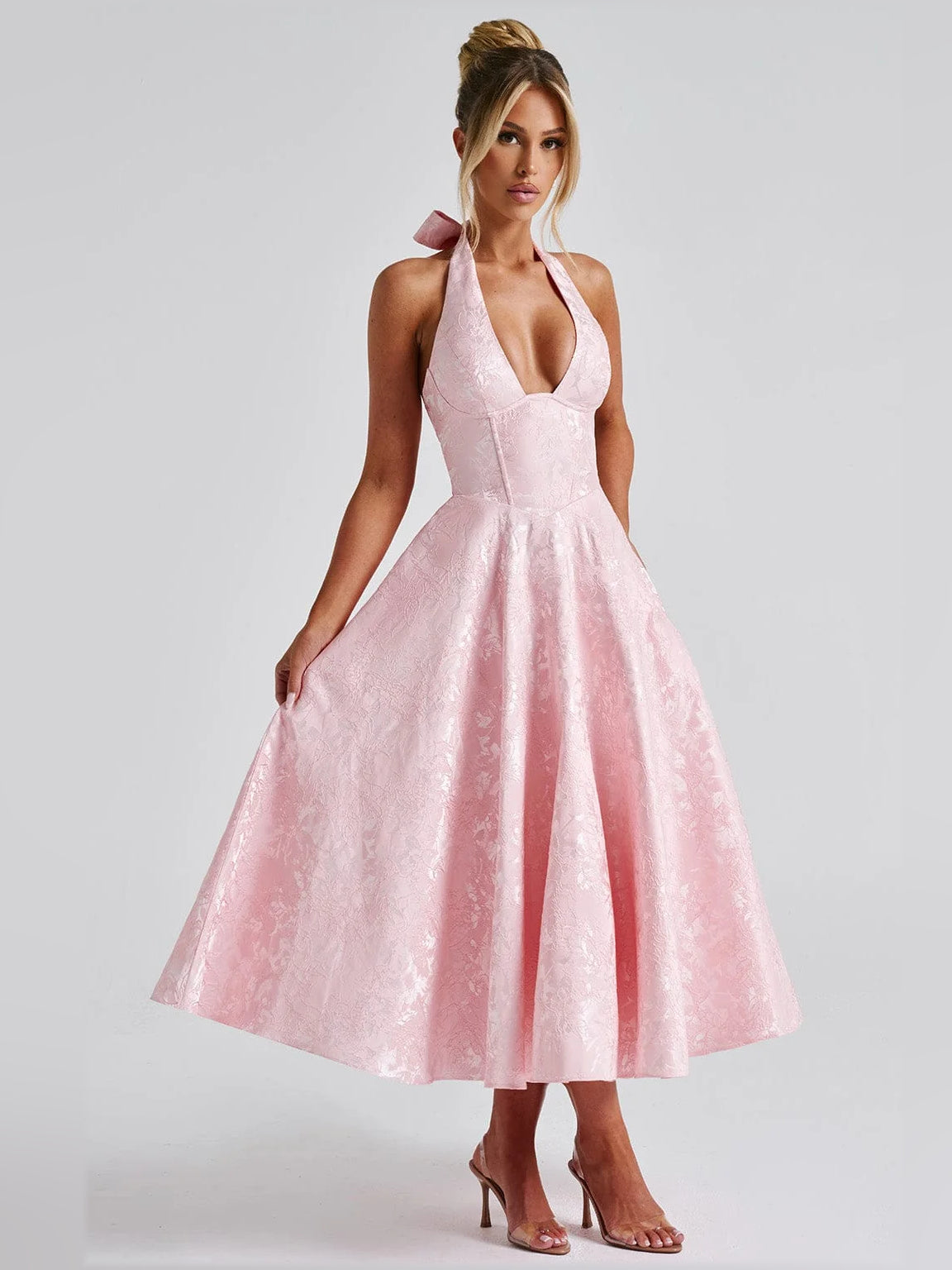 Blush halter midi formal dress with deep V neckline and pleated A-line skirt