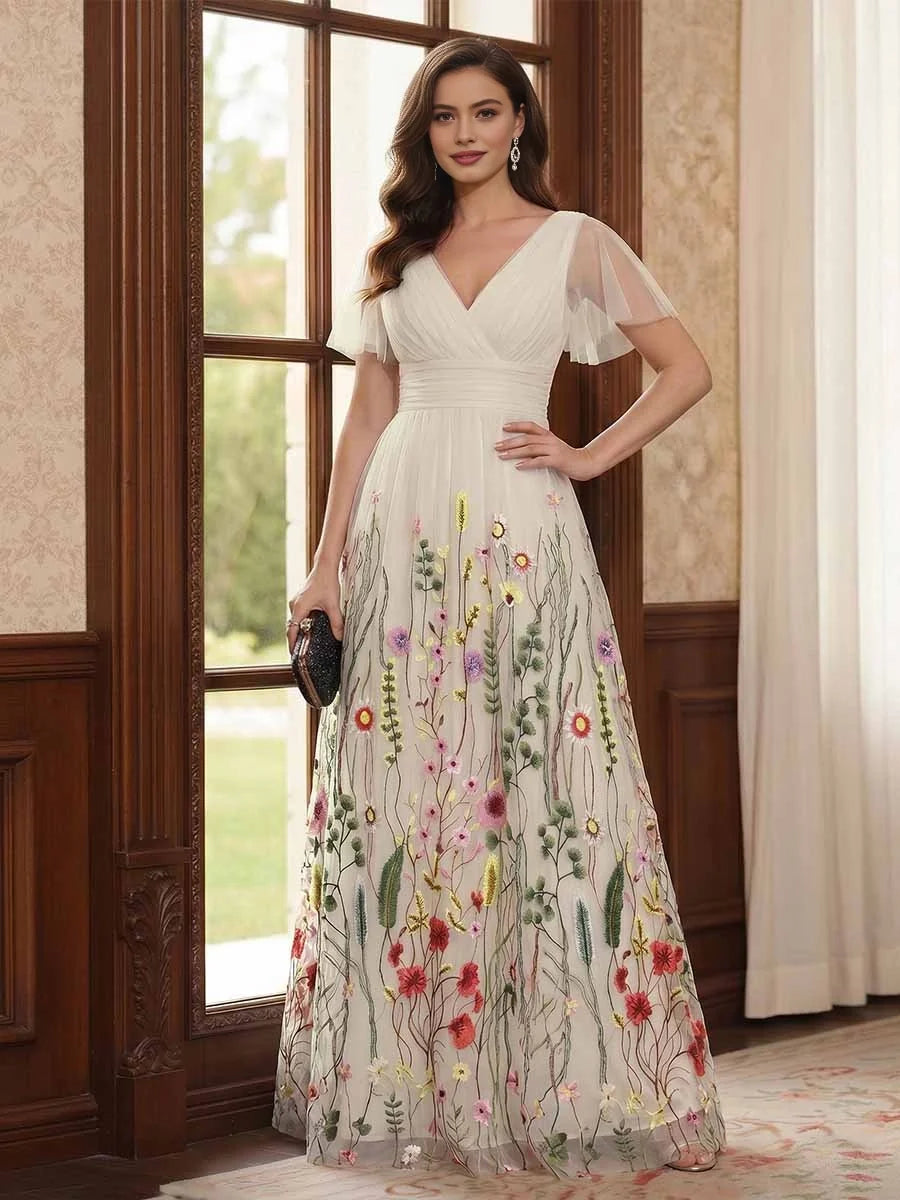 Ivory V-neck A-line tulle dress with ruched waist, short sleeves, and multicolor floral embroidery