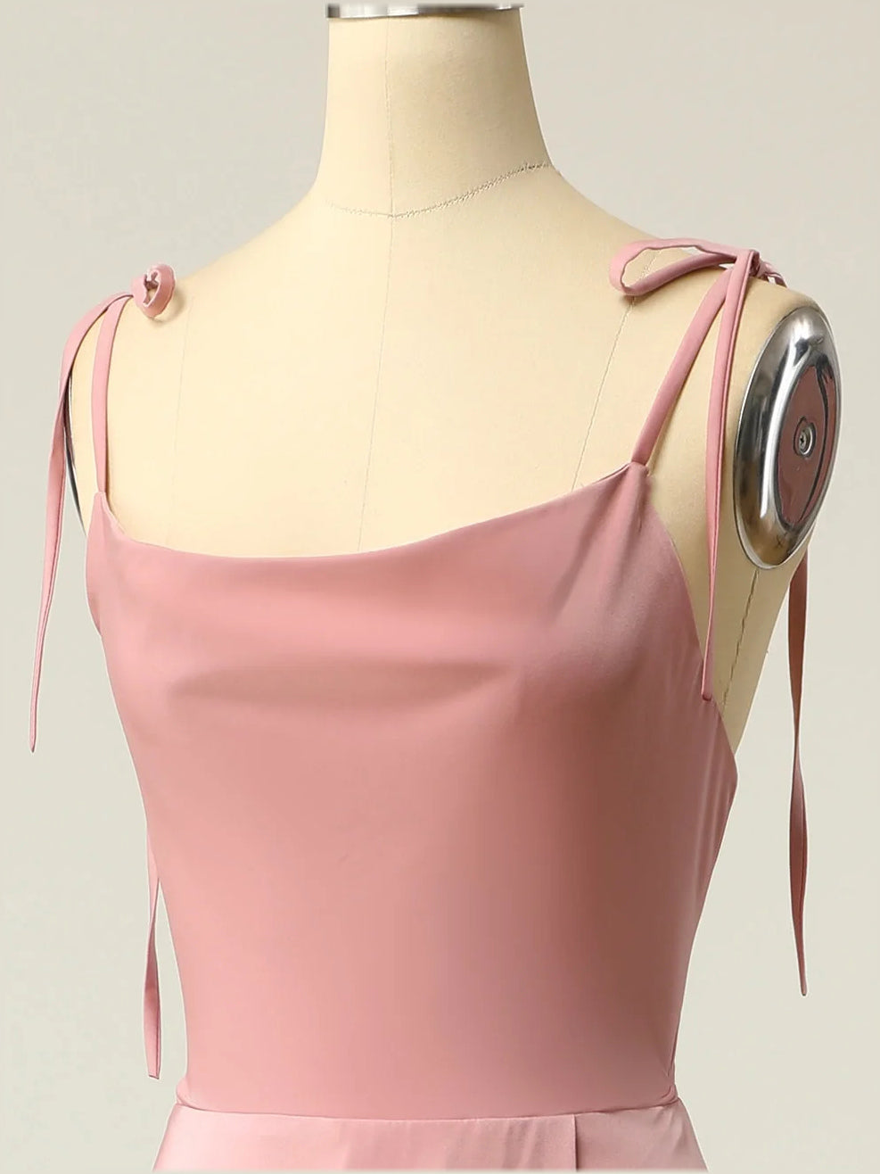 Dusty pink satin draped upper back with tie spaghetti straps and cowl-style neckline