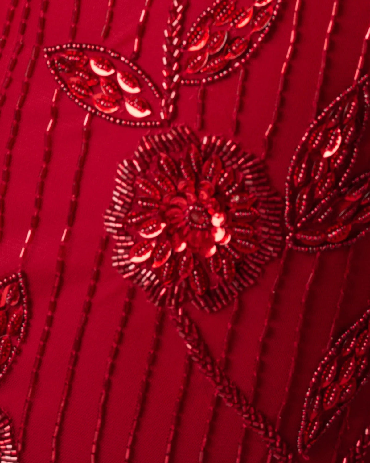 Cranberry beaded floral embellishment detail on sheer fabric