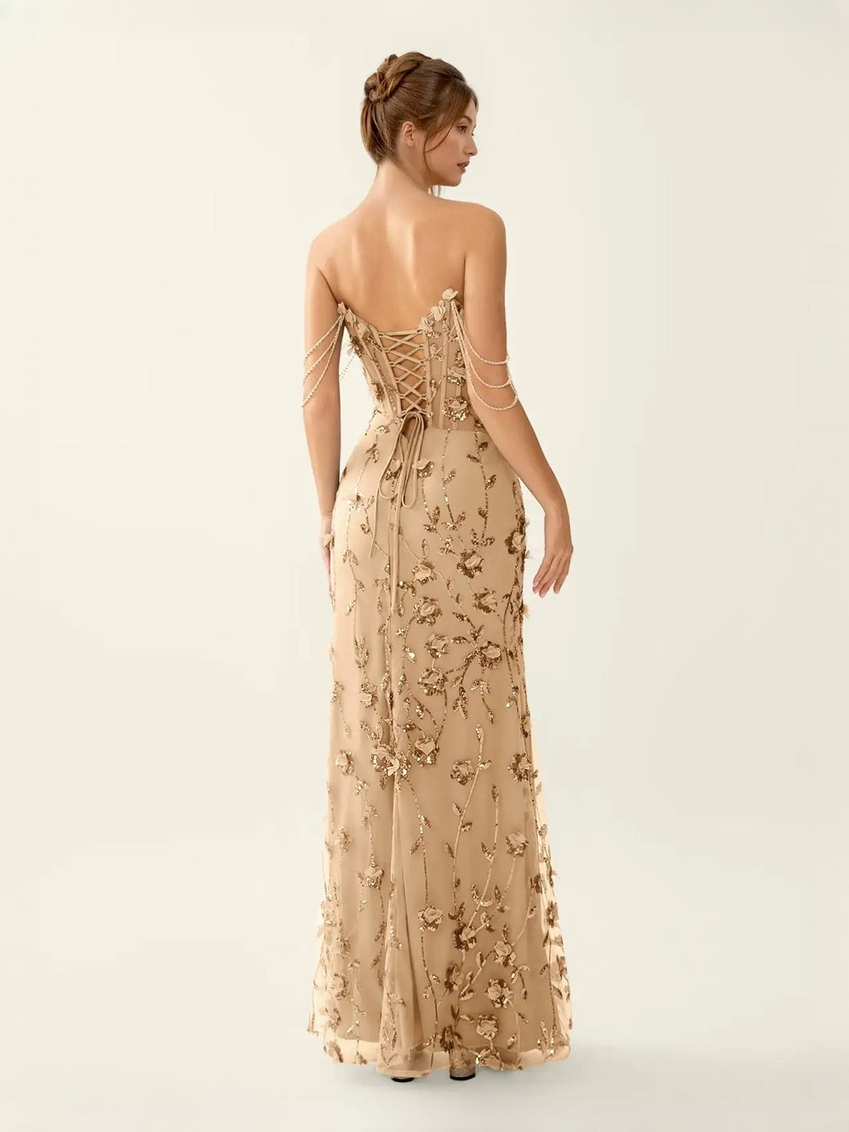 Champagne corset mermaid prom dress with floral appliques and lace-up open back