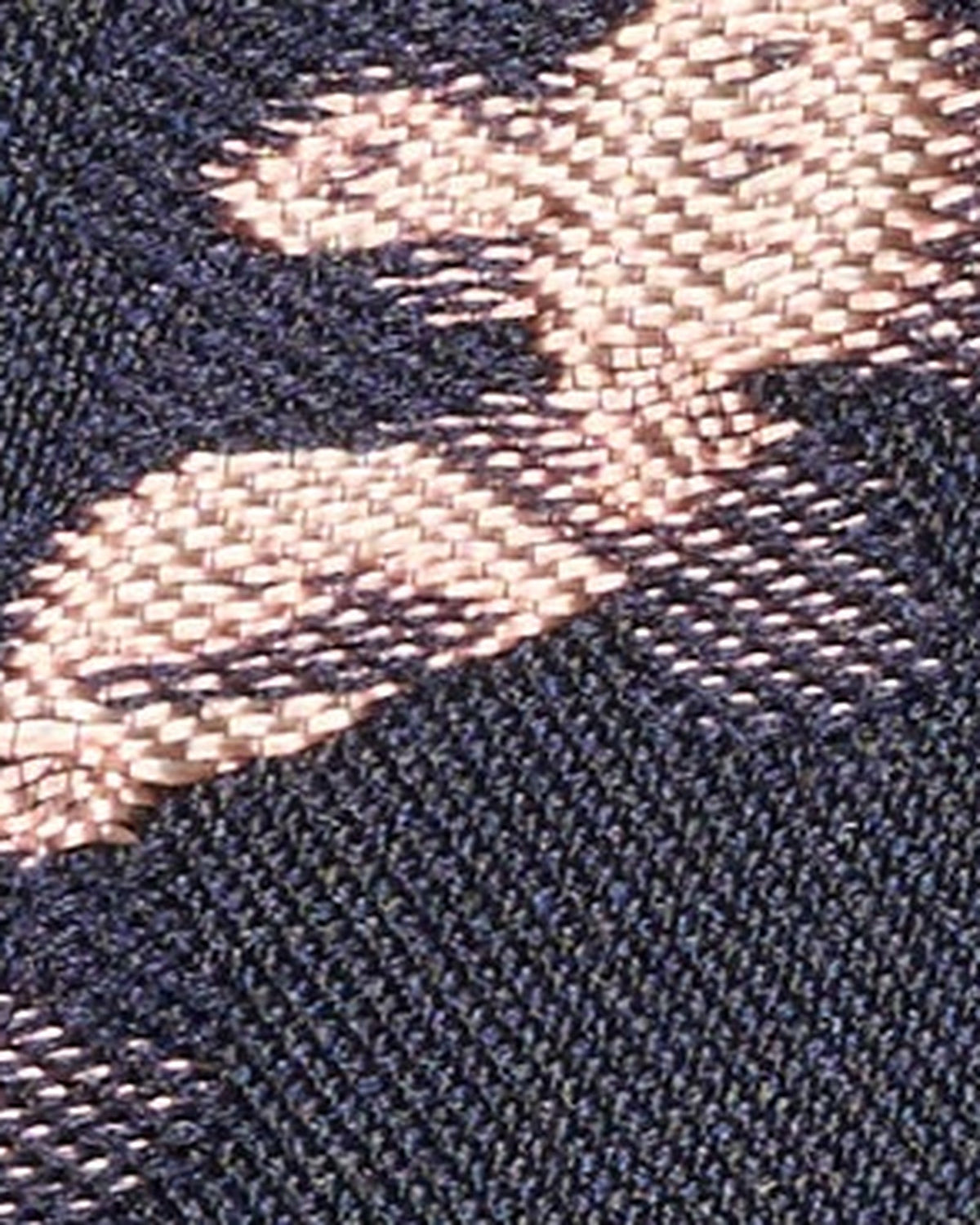 Navy fabric swatch with blush floral pattern detail