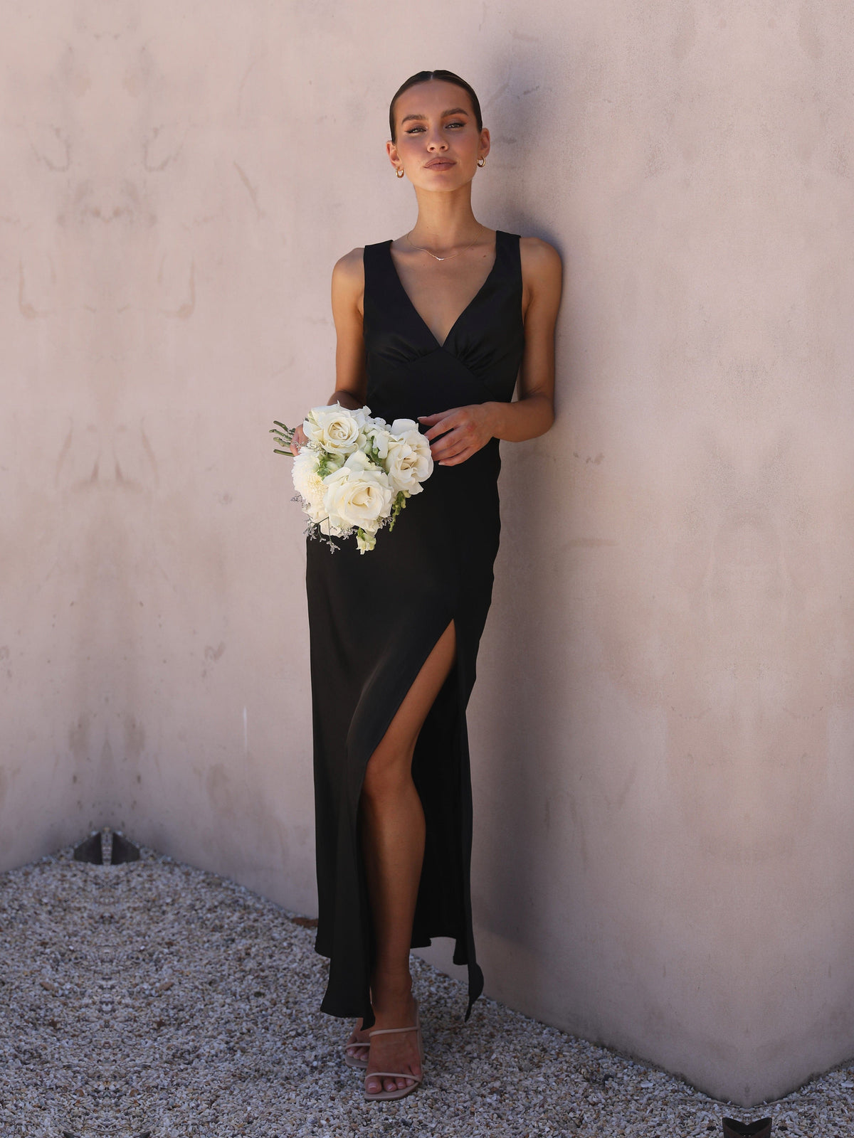 Black sheath maxi formal dress with skirt slit, alternate view showing the hem