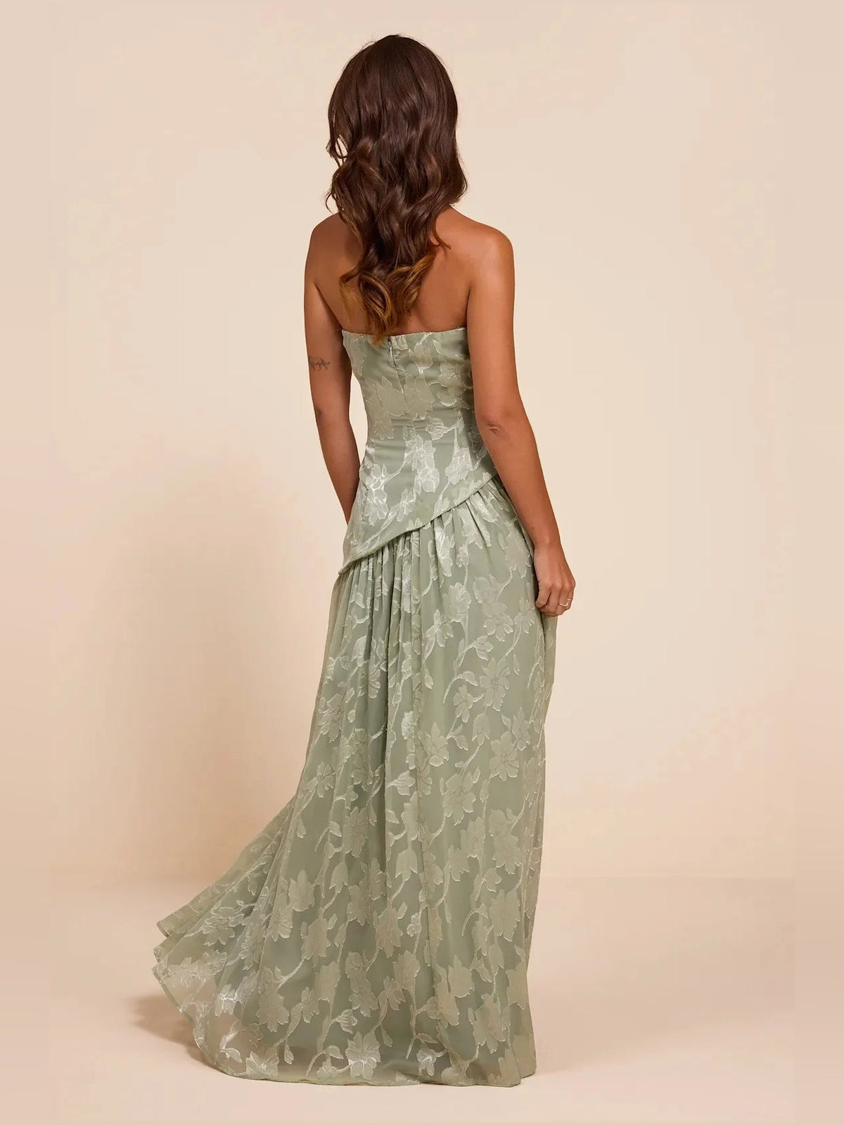 Dusty sage strapless maxi dress with allover floral pattern and back slit
