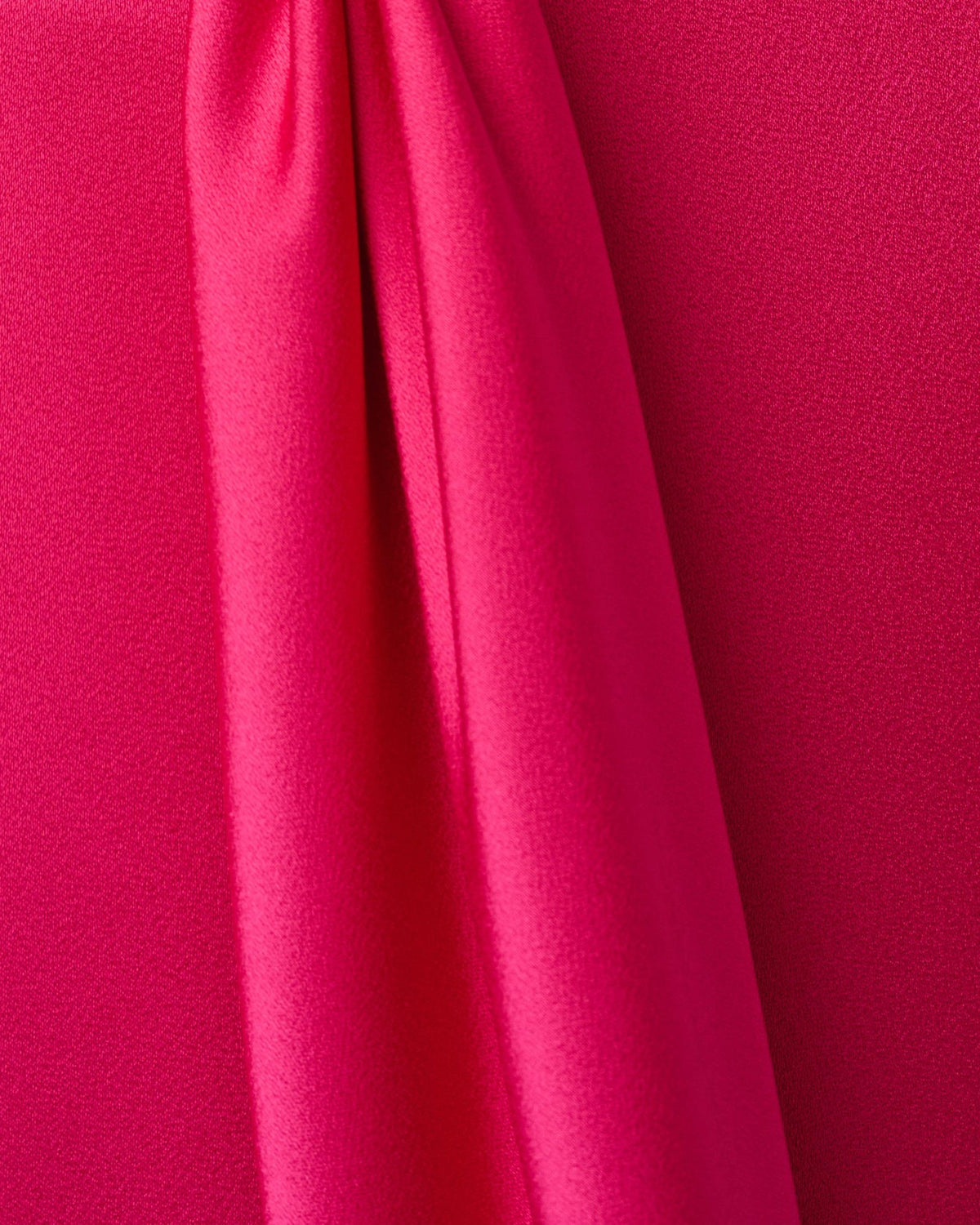 Bright rose textured satin fabric swatch with smooth drape folds