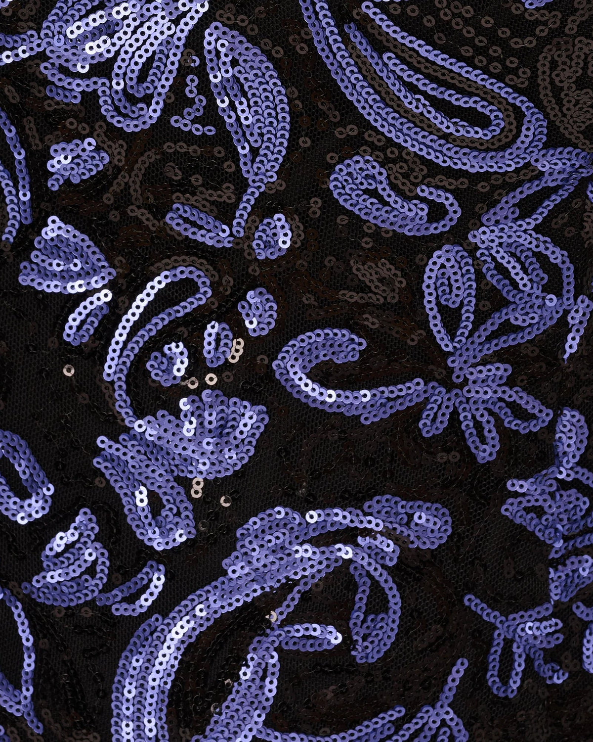 Close-up fabric of navy blue and purple sequin embellishments on maxi dress