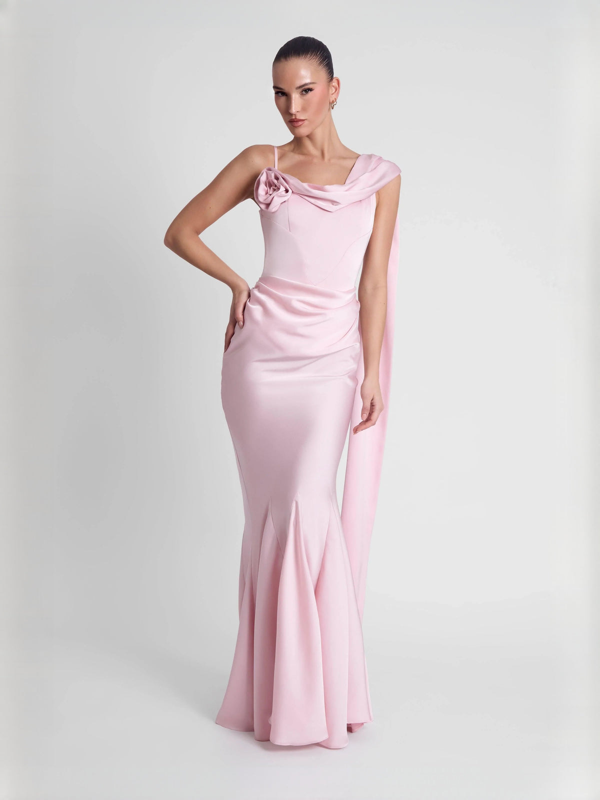 Pink mermaid prom dress with rosette at neckline and draped cap sleeves